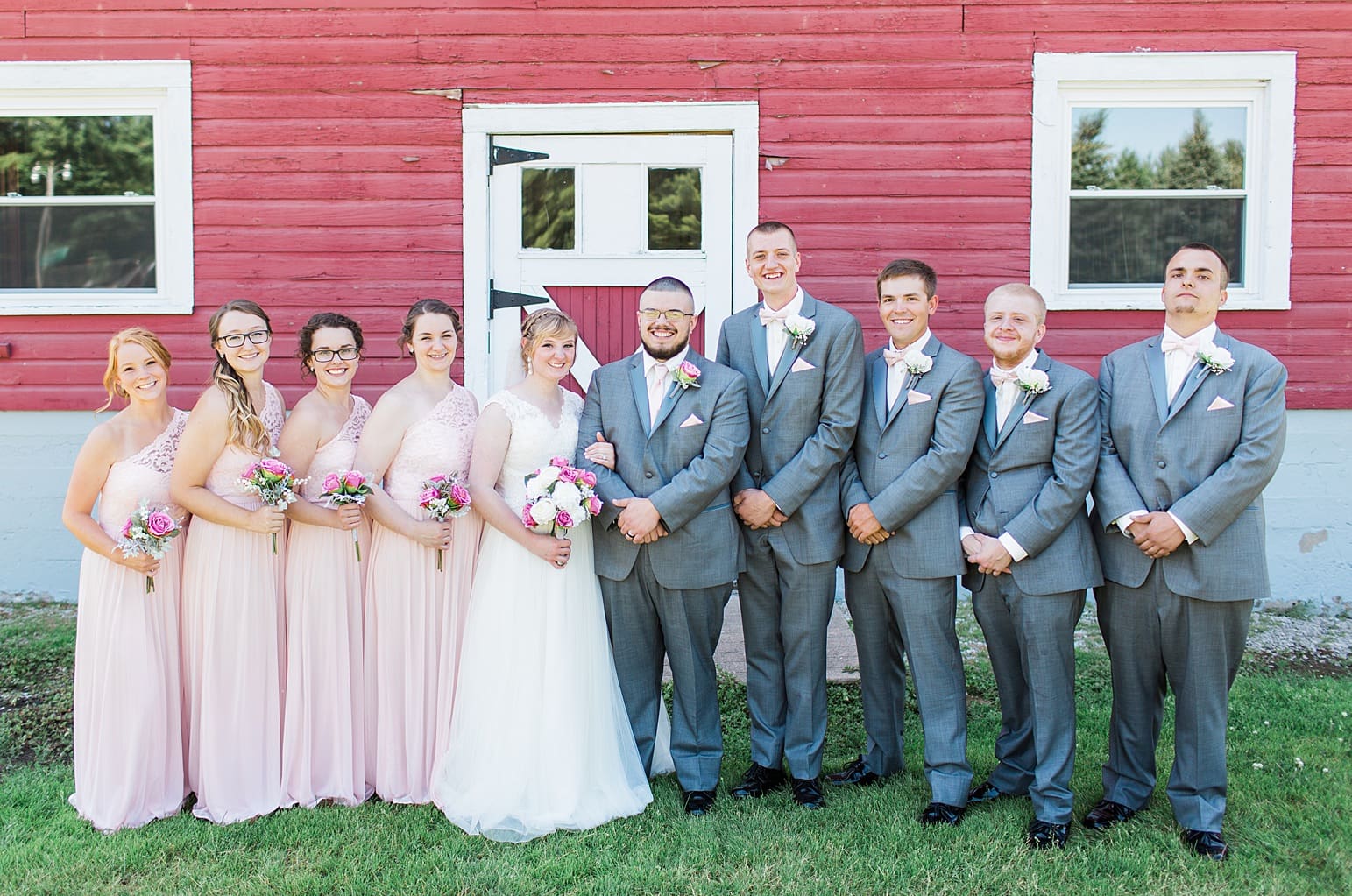 Arielle Peters Photography | Wedding party next to old red barn on wedding day at St. Joseph County Parks in South Bend, Indiana.