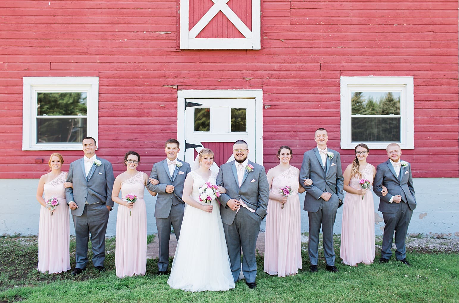 Arielle Peters Photography | Wedding party next to old red barn on wedding day at St. Joseph County Parks in South Bend, Indiana.