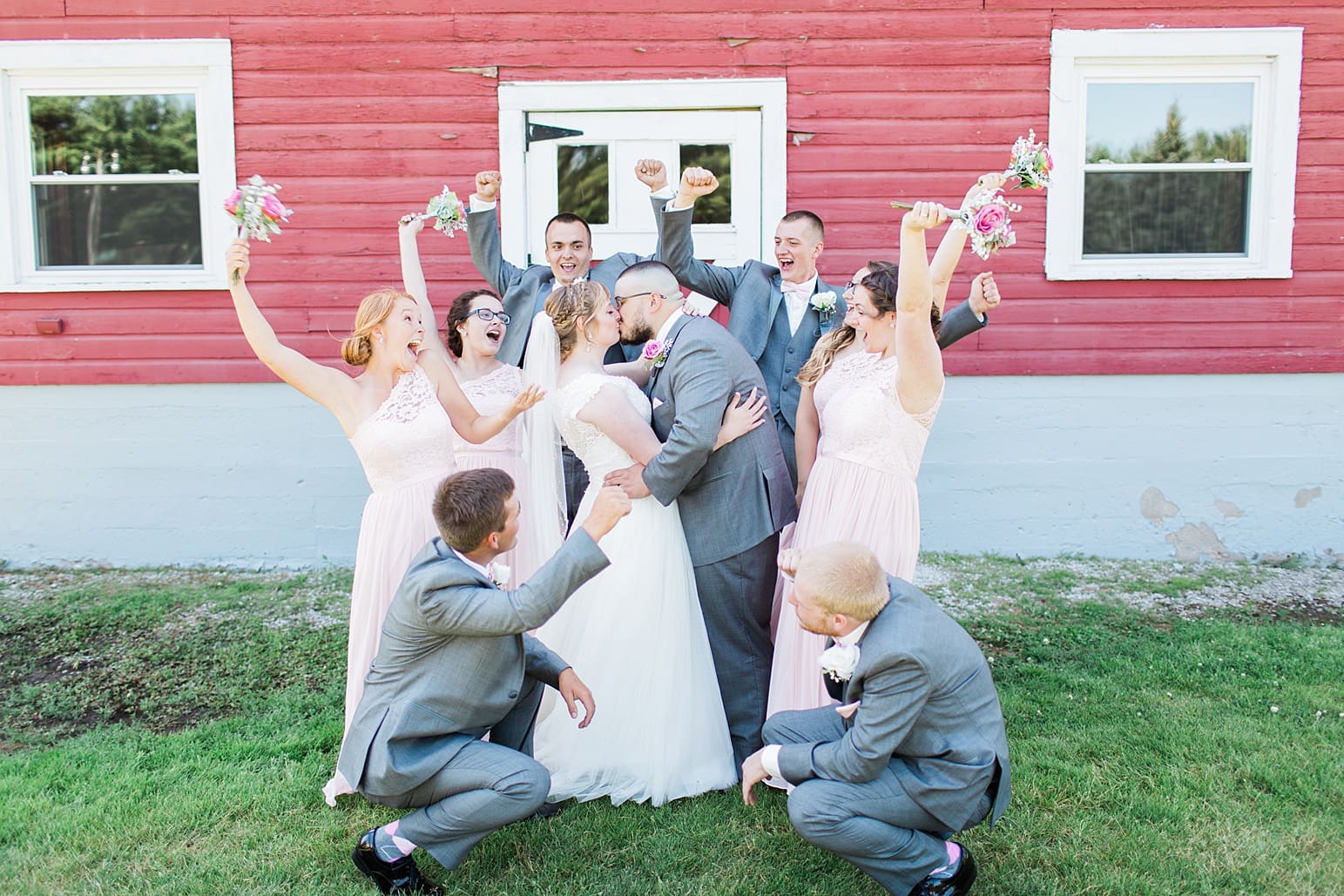 Arielle Peters Photography | Bride and groom kissing next to old red barn on wedding day at St. Joseph County Parks in South Bend, Indiana.