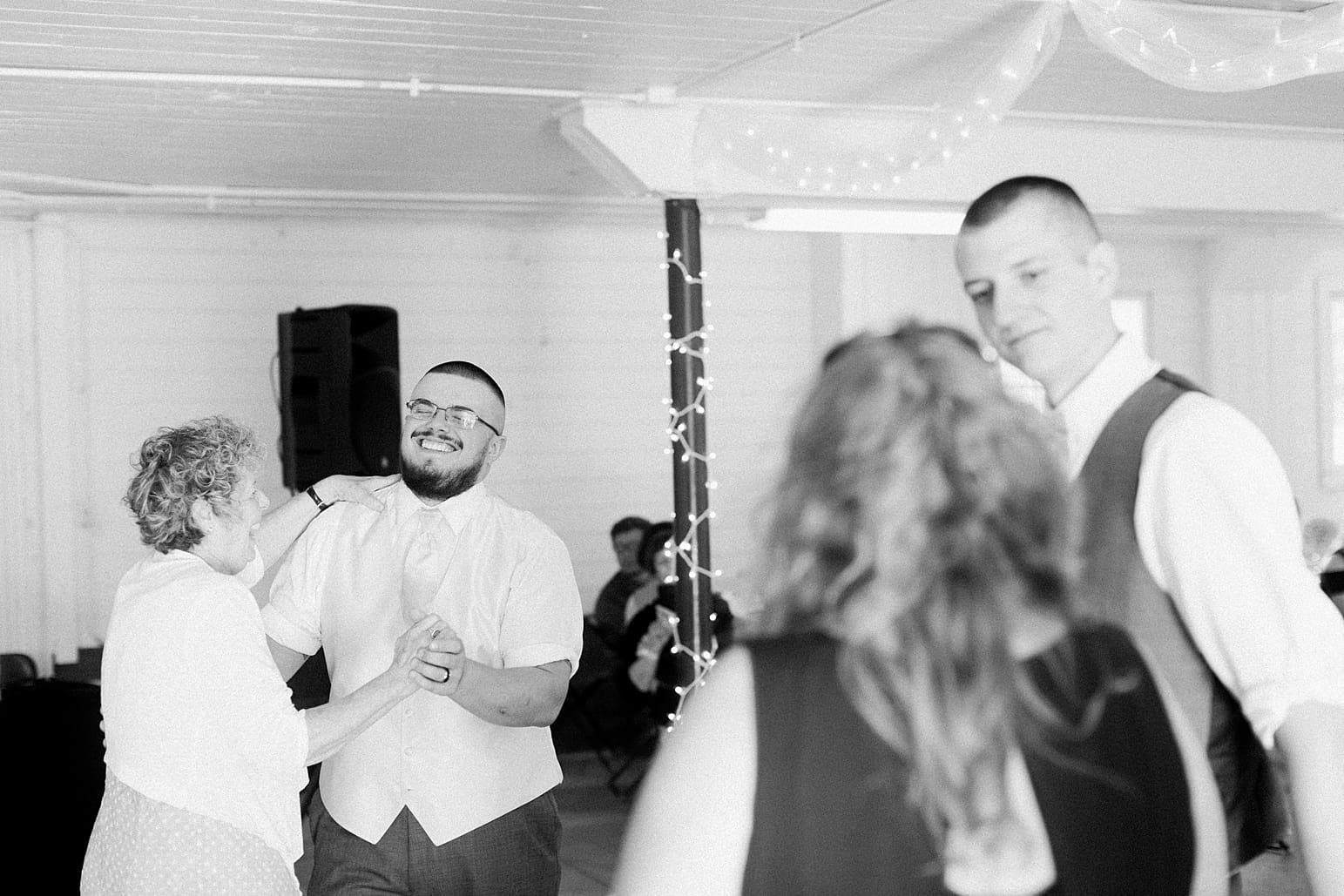 Arielle Peters Photography | Wedding guests slow dancing on wedding day at St. Joseph County Parks in South Bend, Indiana.