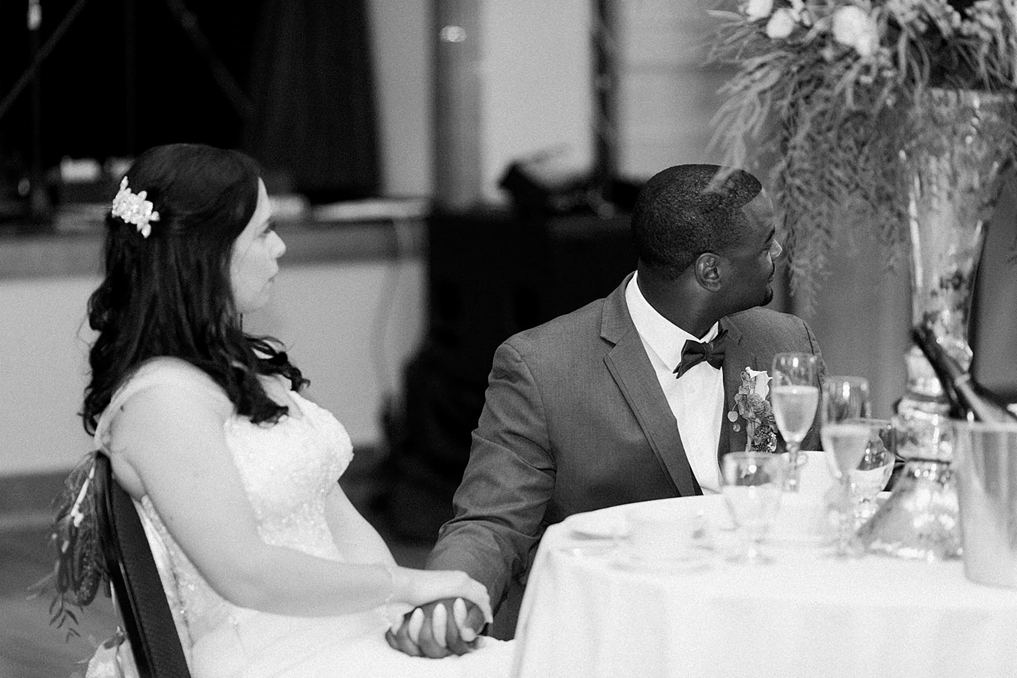 Arielle Peters Photography | Bride and groom holding hands at wedding reception on wedding day at Nazareth Hall in Grand Rapids, Ohio. 