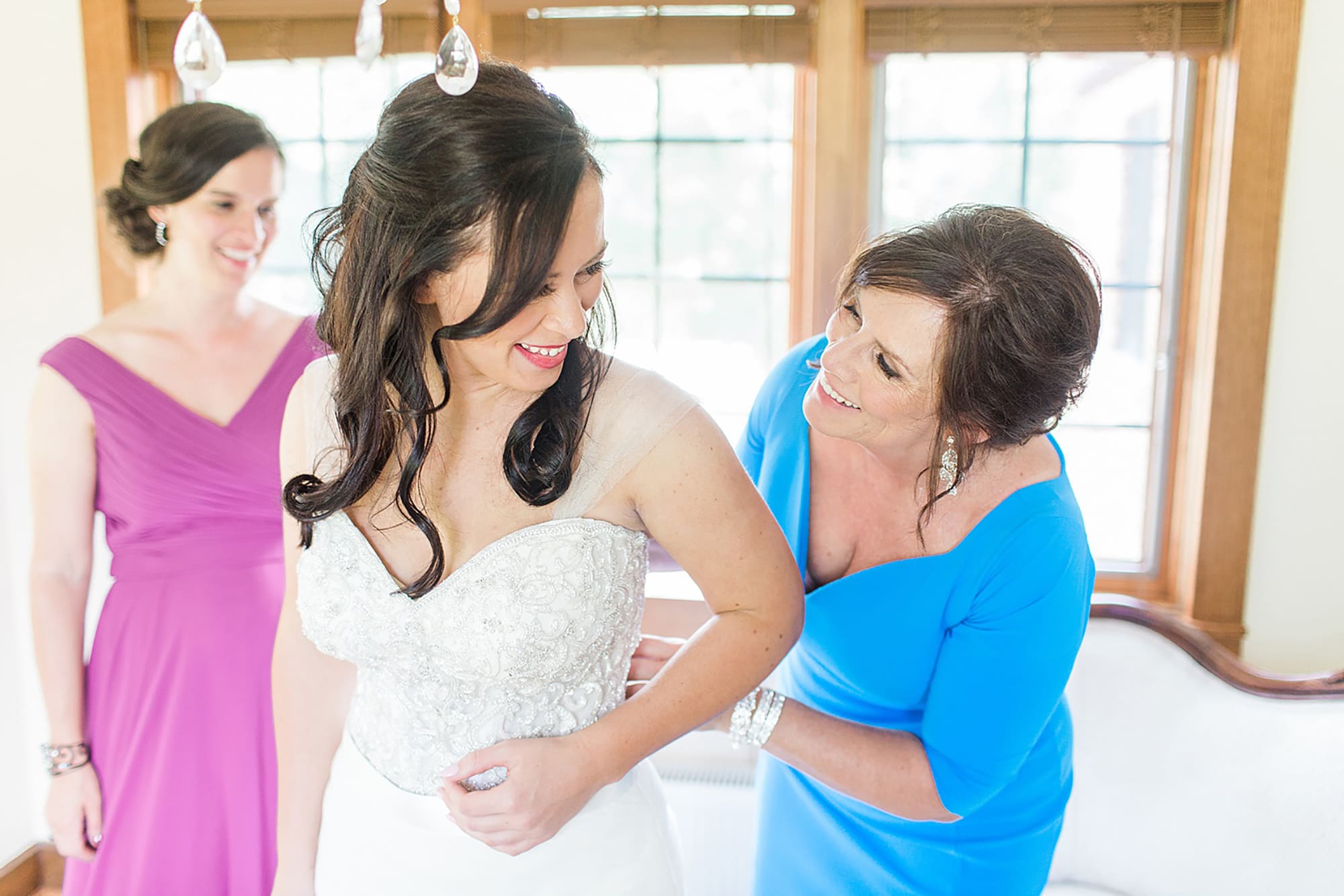 Arielle Peters Photography | Mother of bride helping bride get ready on wedding day photos at Nazareth Hall in Grand Rapids, Ohio. 