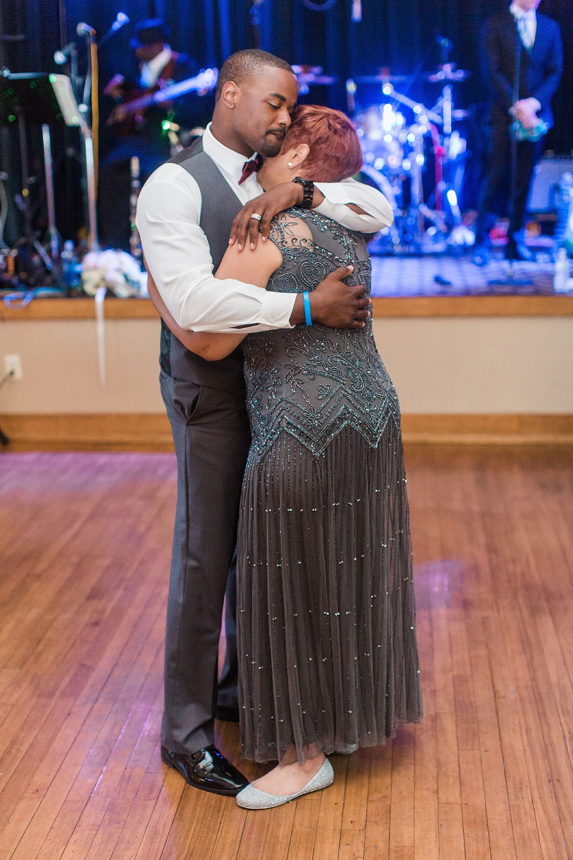 Arielle Peters Photography | Mother of groom and groom sharing a dance at wedding reception on wedding day at Nazareth Hall in Grand Rapids, Ohio. 