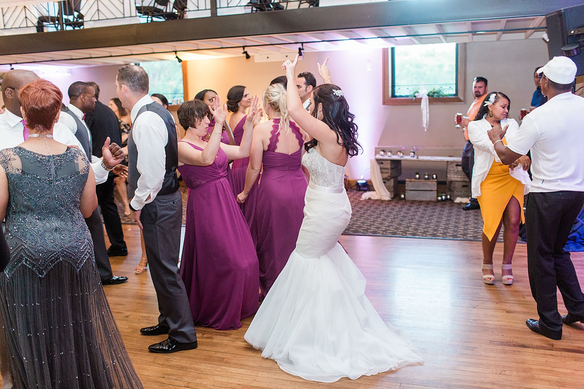 Arielle Peters Photography | Wedding guests dancing at wedding reception on wedding day at Nazareth Hall in Grand Rapids, Ohio. 