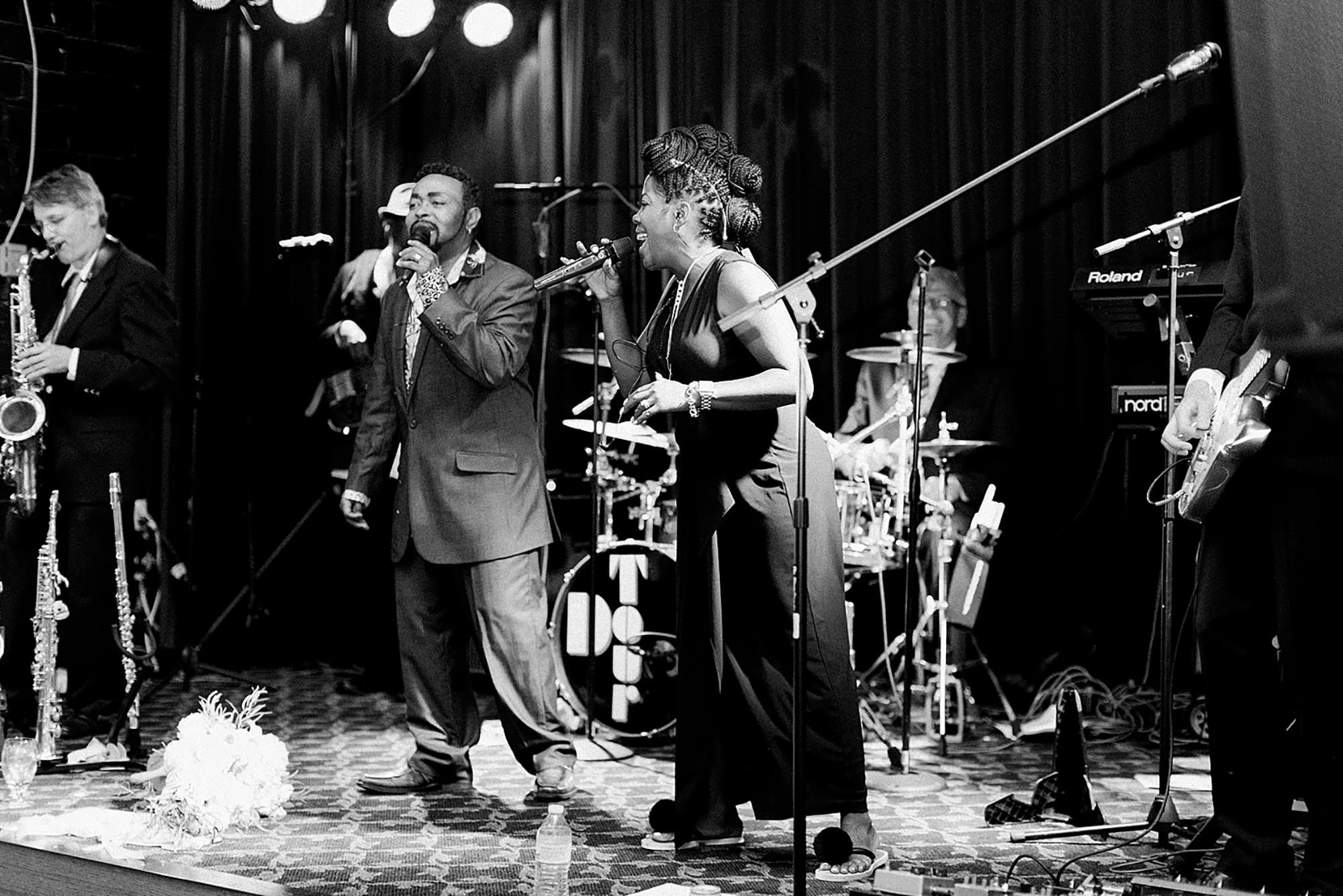 Arielle Peters Photography | Wedding band singing at wedding reception on wedding day at Nazareth Hall in Grand Rapids, Ohio. 