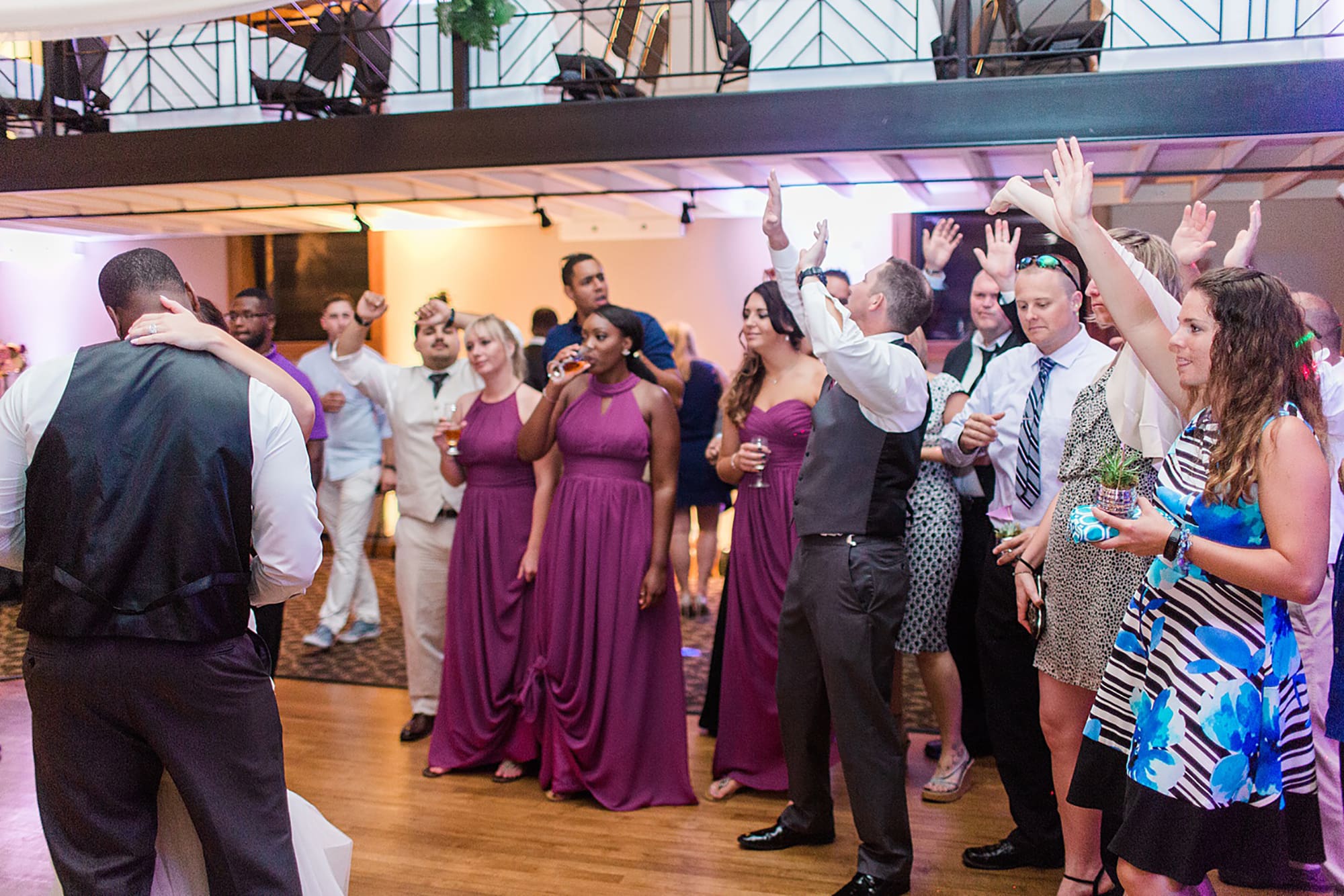 Arielle Peters Photography | Wedding guests dancing at wedding reception on wedding day at Nazareth Hall in Grand Rapids, Ohio. 