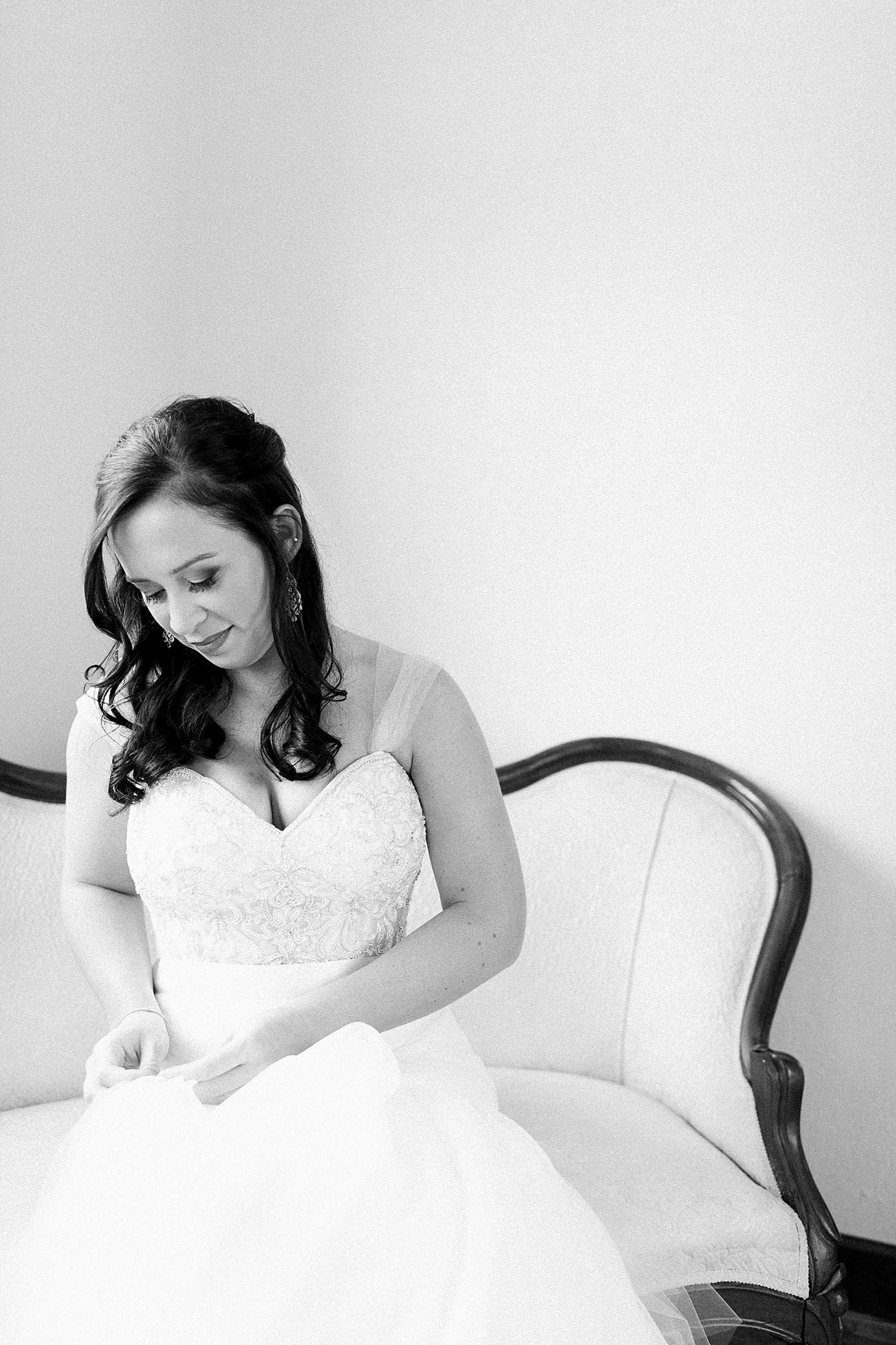 Arielle Peters Photography | Bride sitting in wedding gown on wedding day photos at Nazareth Hall in Grand Rapids, Ohio. 