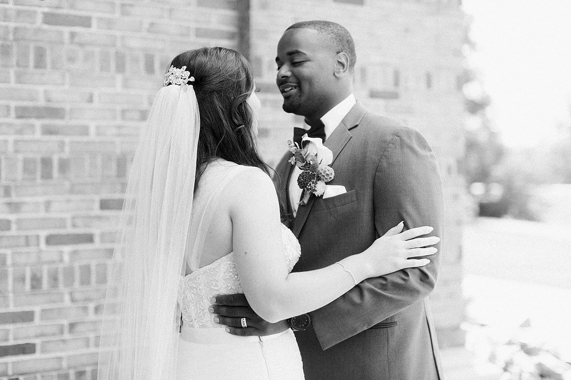 Arielle Peters Photography | Bride and groom having first reveal on wedding day photos at Nazareth Hall in Grand Rapids, Ohio. 