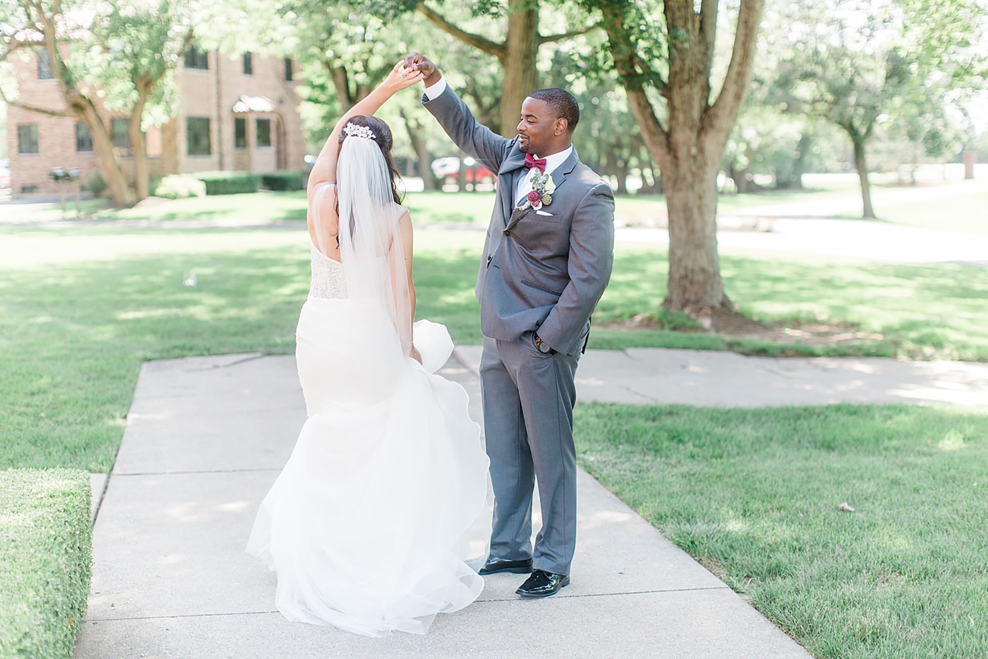 Arielle Peters Photography | Bride and groom dancing outside on wedding day photos at Nazareth Hall in Grand Rapids, Ohio. 