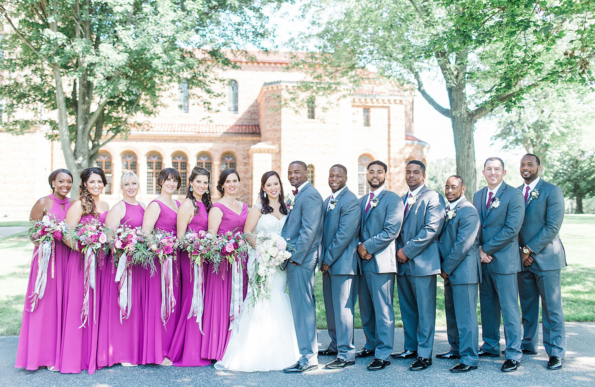 Arielle Peters Photography | Wedding party next to brick building on wedding day photos at Nazareth Hall in Grand Rapids, Ohio. 