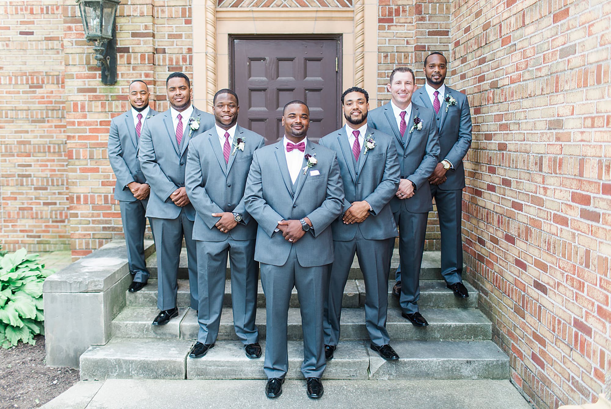 Arielle Peters Photography | Groom and groomsmen on brick steps on wedding day photos at Nazareth Hall in Grand Rapids, Ohio. 