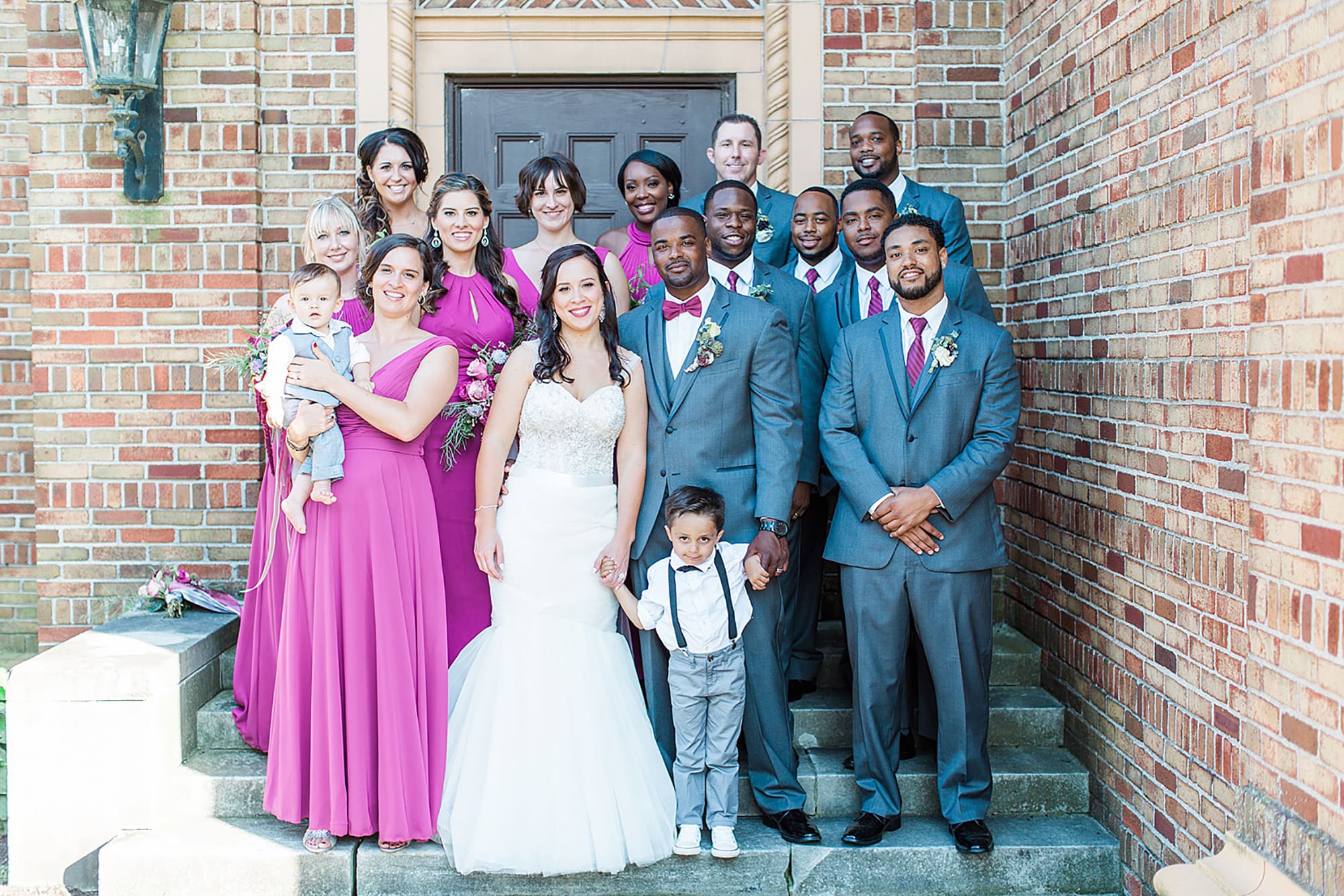 Arielle Peters Photography | Wedding party next to brick building on wedding day photos at Nazareth Hall in Grand Rapids, Ohio. 