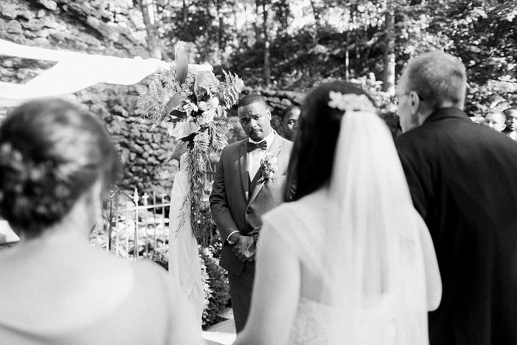 Arielle Peters Photography | Groom crying while bride walks down aisle on wedding day photos at Nazareth Hall in Grand Rapids, Ohio. 