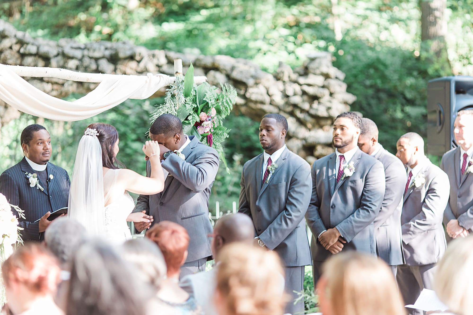 Arielle Peters Photography | Bride and groom holding hands at the alter at outdoor wedding day at Nazareth Hall in Grand Rapids, Ohio. 