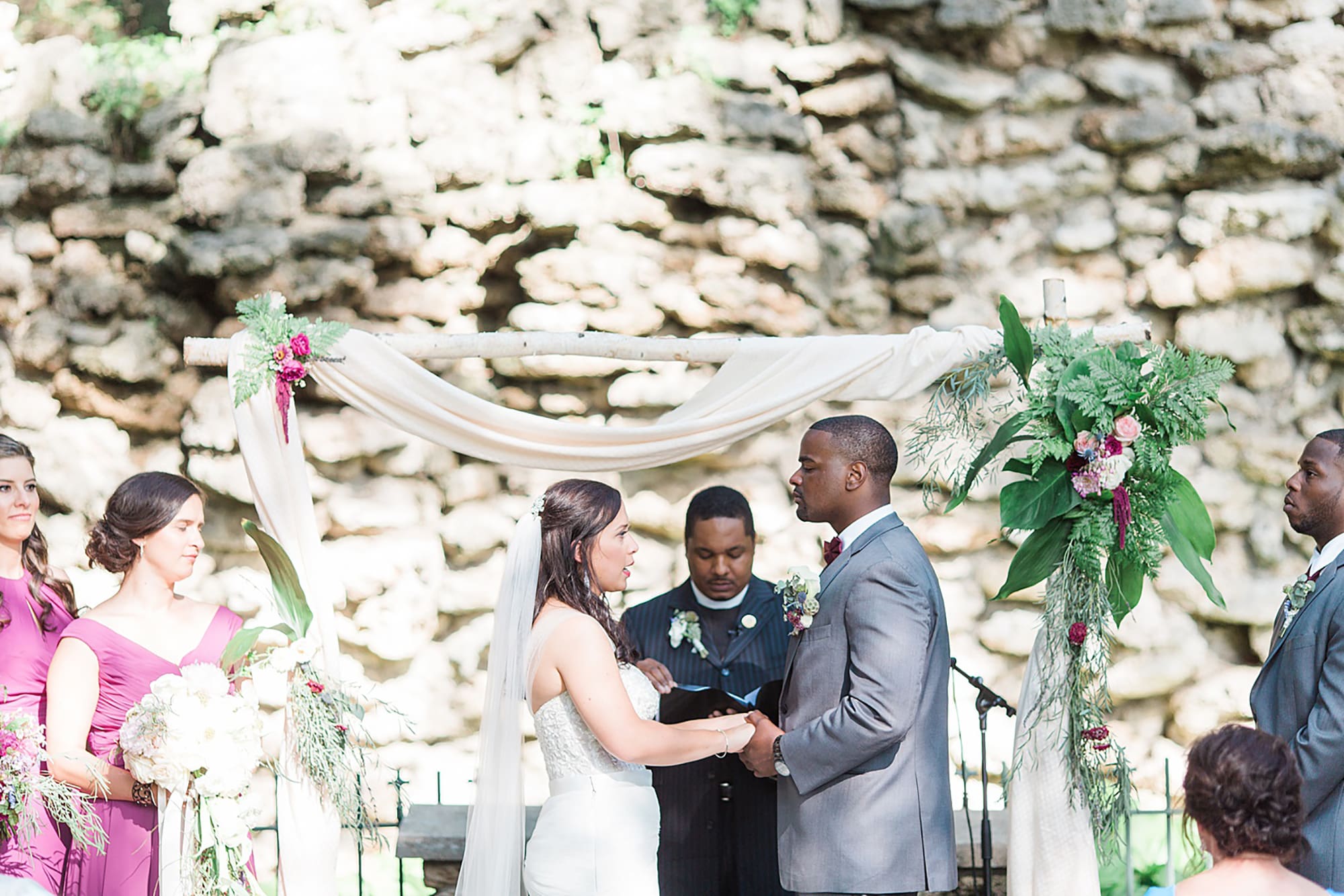 Arielle Peters Photography | Bride and groom holding hands at the alter at outdoor wedding day at Nazareth Hall in Grand Rapids, Ohio. 