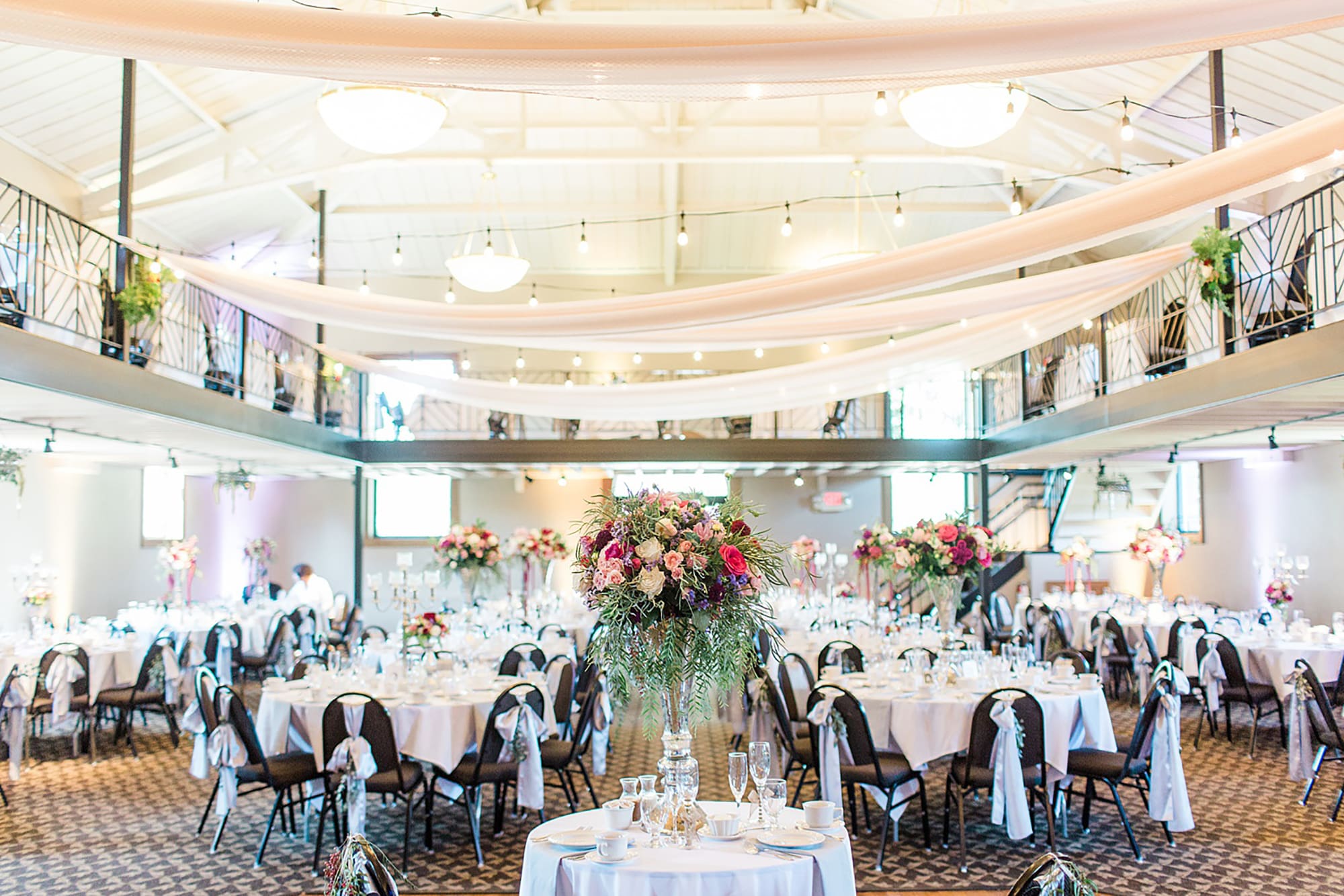 Arielle Peters Photography | Wedding reception table settings and floral arrangements at Nazareth Hall in Grand Rapids, Ohio. 