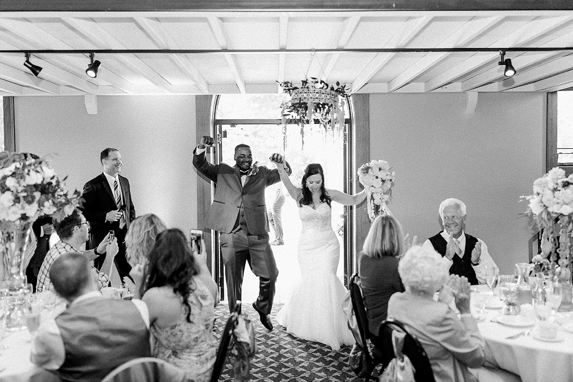 Arielle Peters Photography | Bride and groom entering wedding reception on wedding day at Nazareth Hall in Grand Rapids, Ohio. 