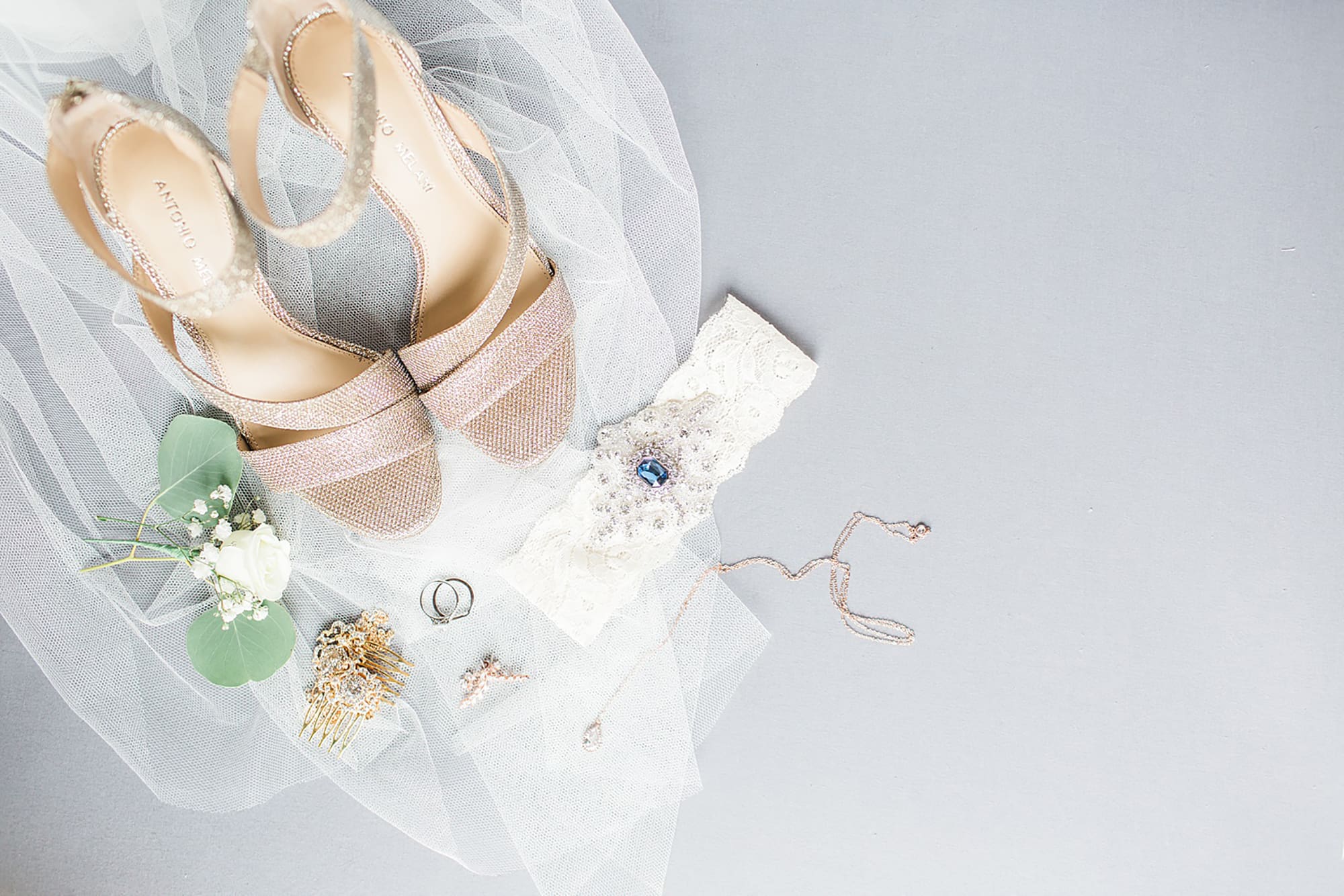 Arielle Peters Photography | Bride's shoes and veil on gray background on wedding day at Winona Heritage Room in Winona Lake, Indiana. 