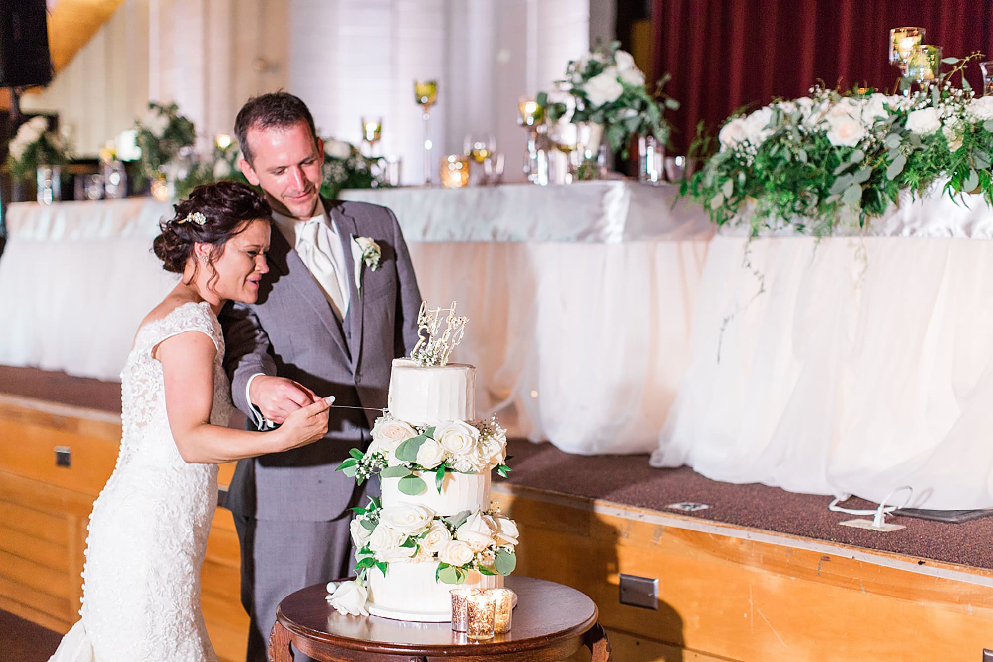 Arielle Peters Photography | Bride and groom cutting wedding cake on wedding day at Winona Heritage Room in Winona Lake, Indiana.