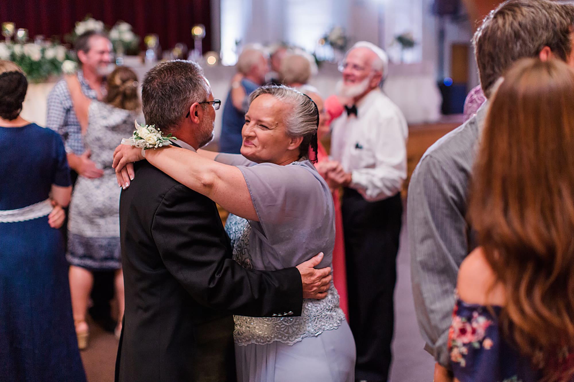 Arielle Peters Photography | Wedding guests dancing on wedding day at Winona Heritage Room in Winona Lake, Indiana.