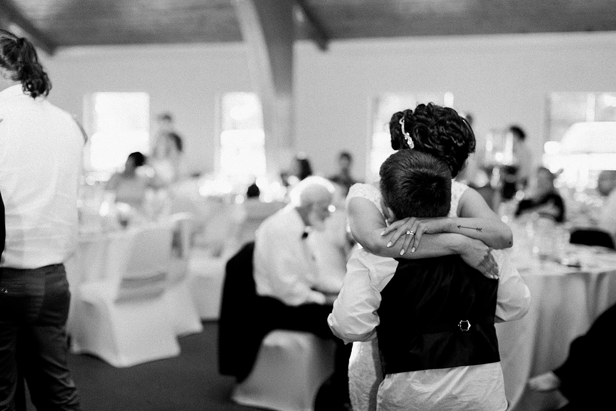 Arielle Peters Photography | Bride and her son hugging on wedding day at Winona Heritage Room in Winona Lake, Indiana.