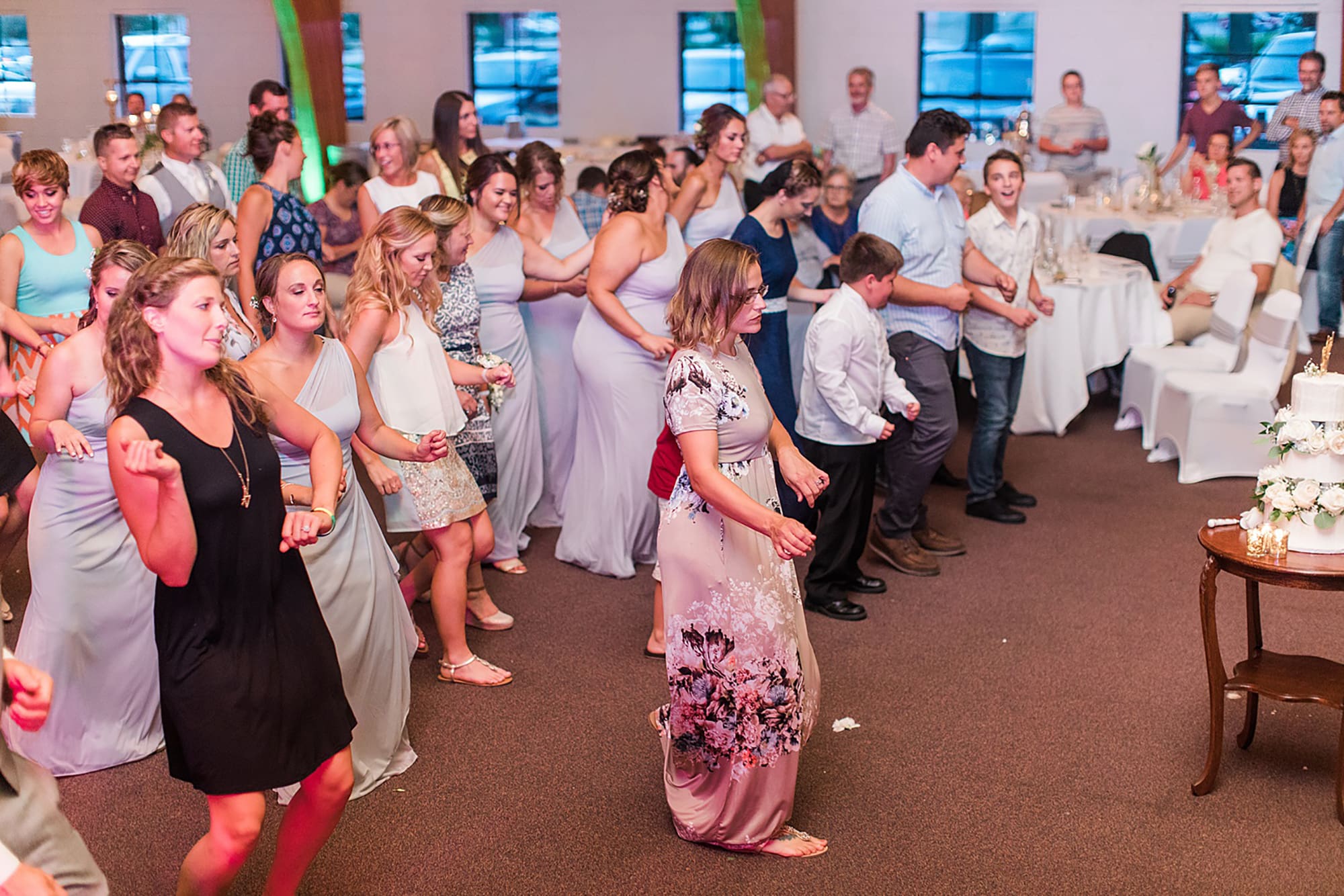 Arielle Peters Photography | Wedding guests dancing on wedding day at Winona Heritage Room in Winona Lake, Indiana.