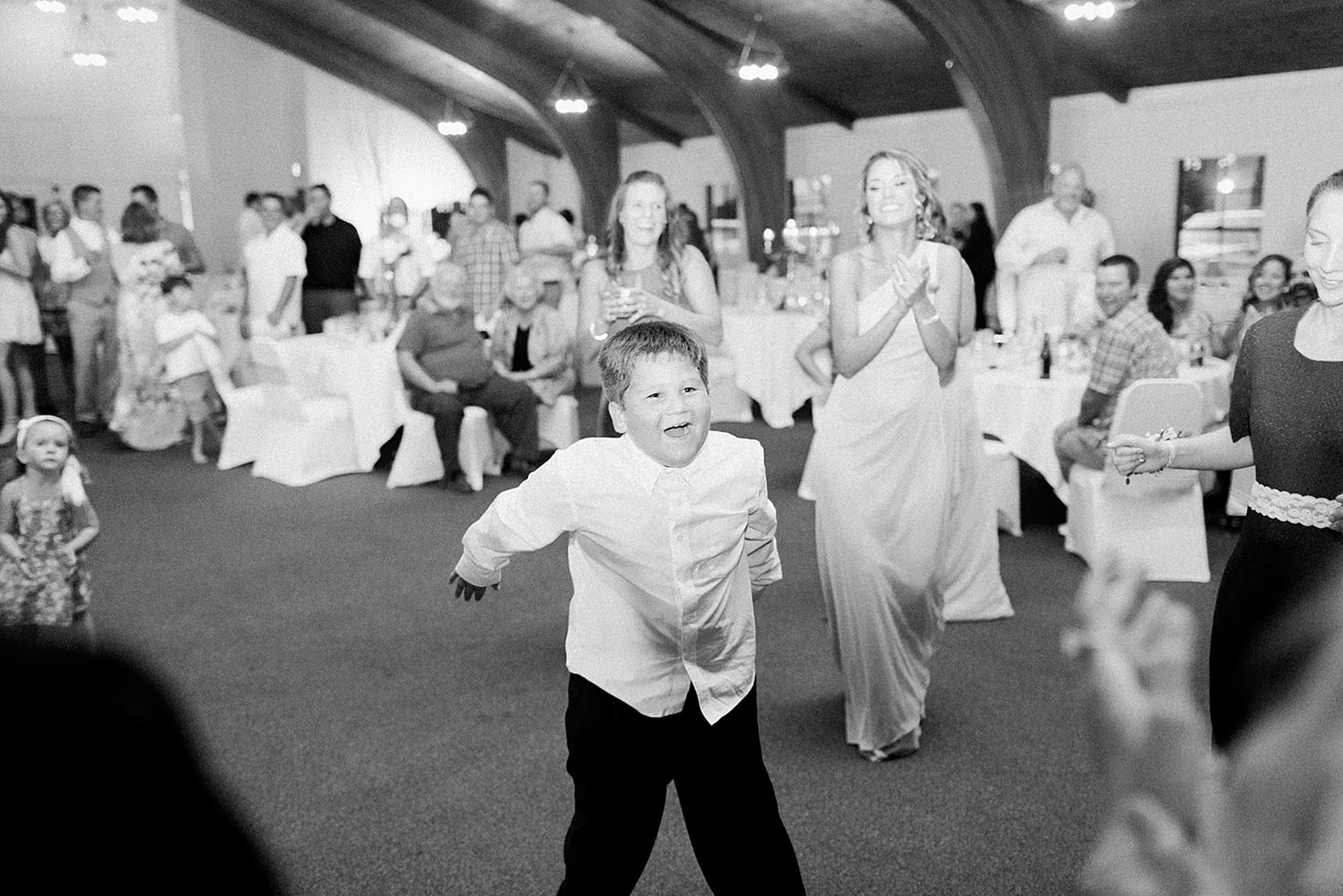 Arielle Peters Photography | Wedding guests dancing on wedding day at Winona Heritage Room in Winona Lake, Indiana.