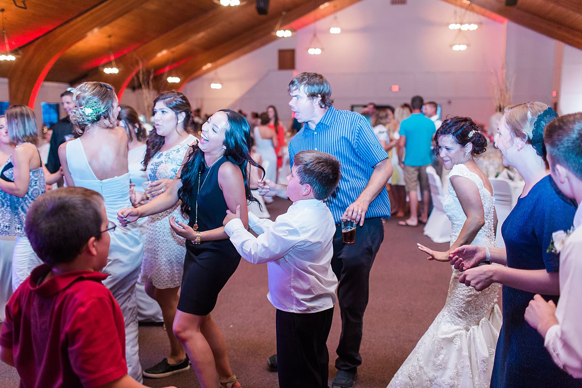 Arielle Peters Photography | Wedding guests dancing on wedding day at Winona Heritage Room in Winona Lake, Indiana.