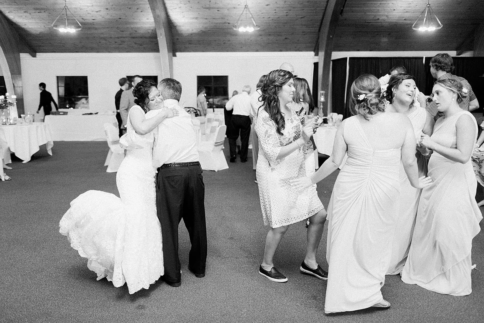 Arielle Peters Photography | Wedding guests dancing on wedding day at Winona Heritage Room in Winona Lake, Indiana.