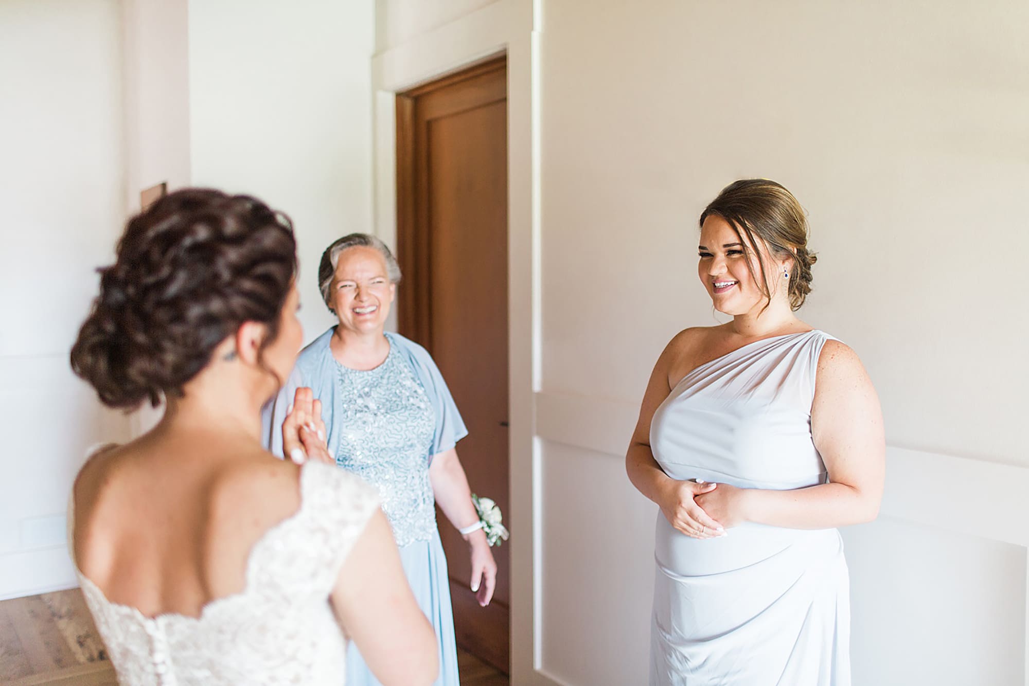 Arielle Peters Photography | Bride and sister having first reveal on wedding day at Winona Heritage Room in Winona Lake, Indiana.