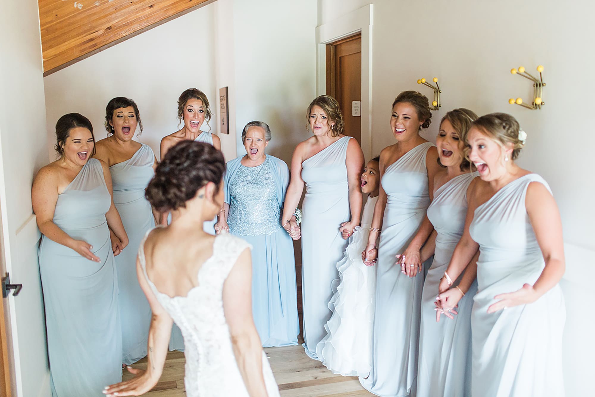 Arielle Peters Photography | Bride and bridesmaids having first reveal on wedding day at Winona Heritage Room in Winona Lake, Indiana.