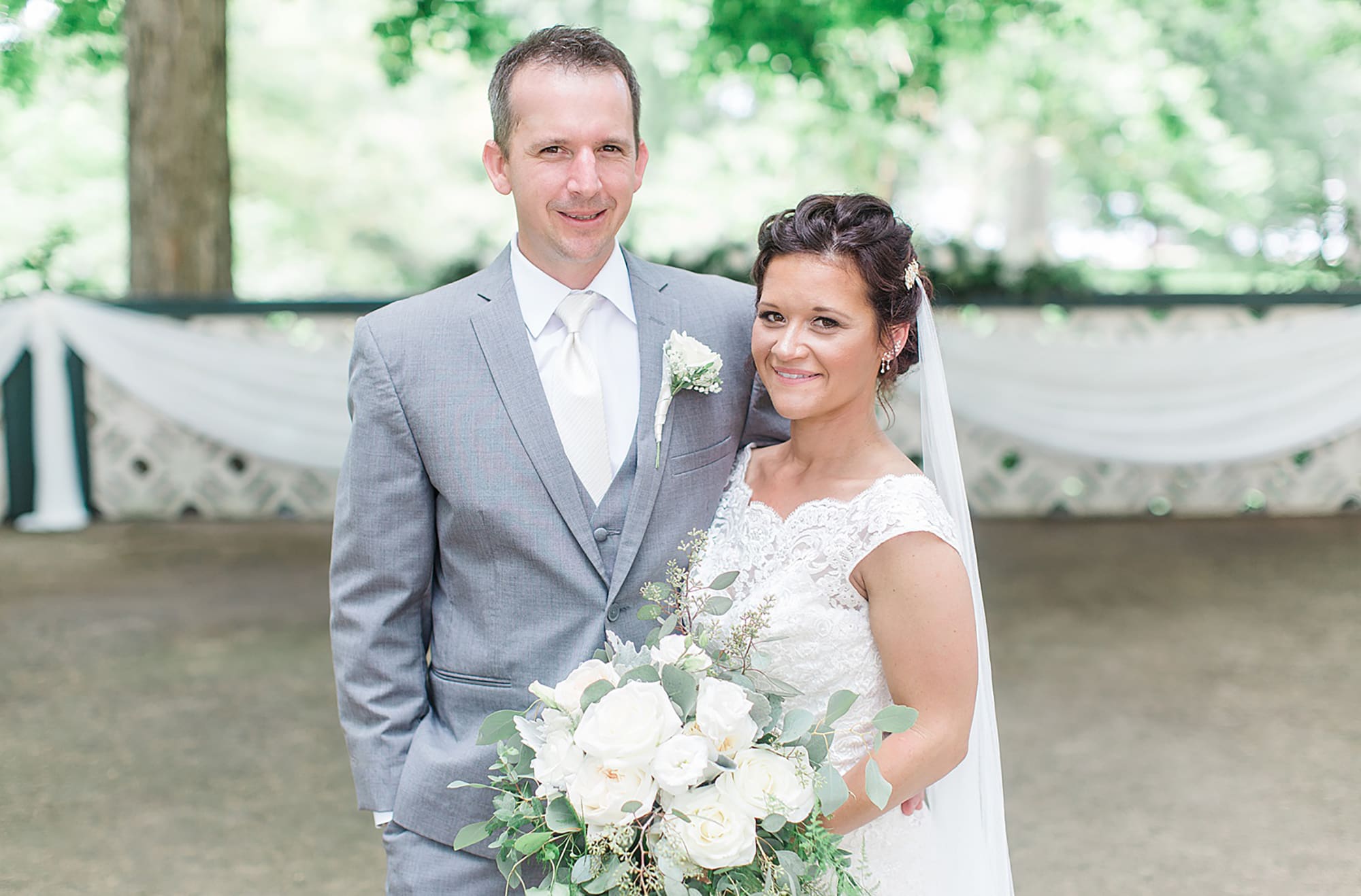 Arielle Peters Photography | Bride and groom in garden on wedding day at Winona Heritage Room in Winona Lake, Indiana.