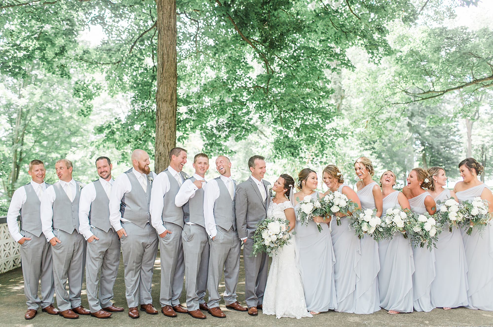 Arielle Peters Photography | Wedding party in park on wedding day at Winona Heritage Room in Winona Lake, Indiana.
