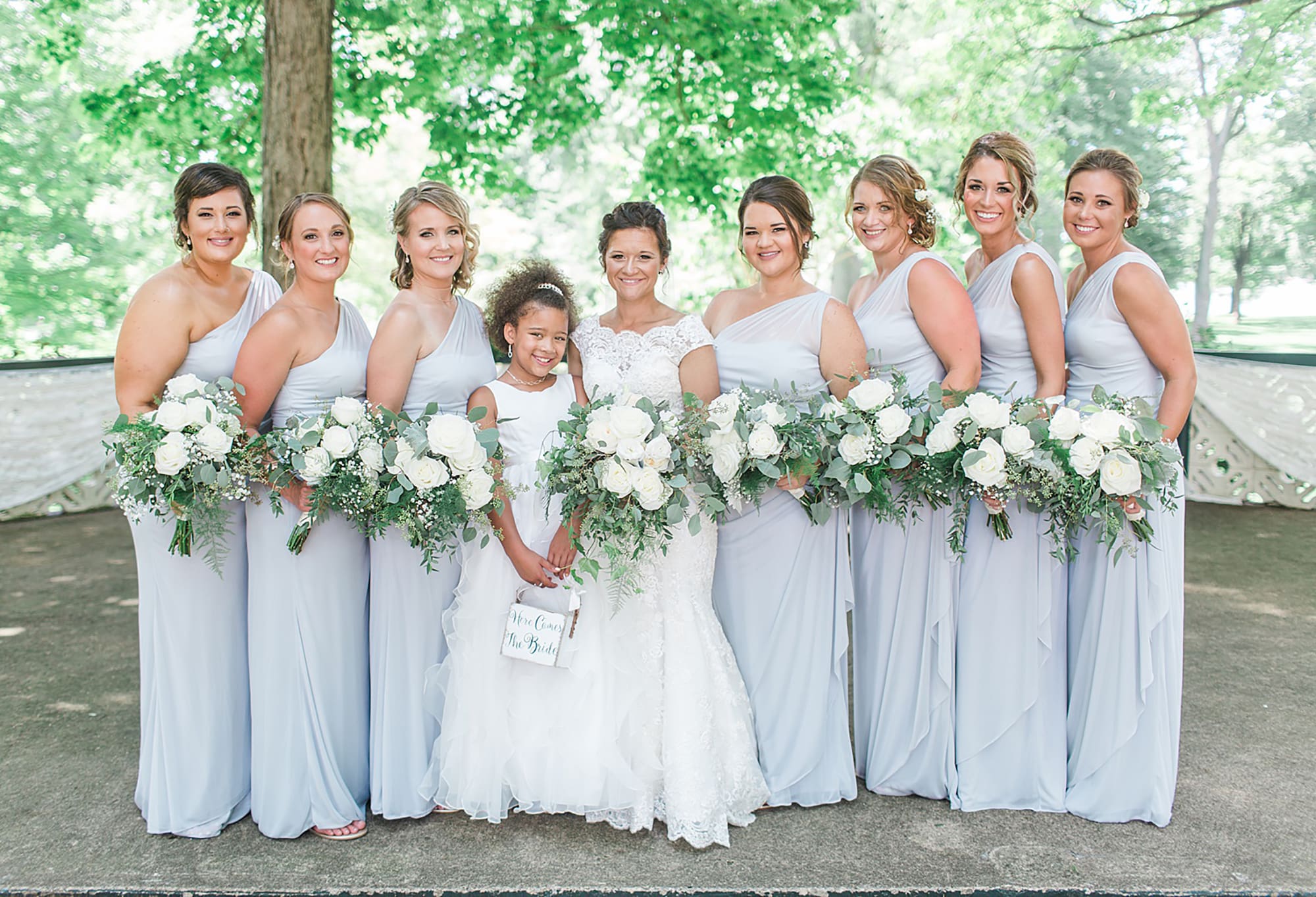 Arielle Peters Photography | Bride and bridesmaids in park on wedding day at Winona Heritage Room in Winona Lake, Indiana.