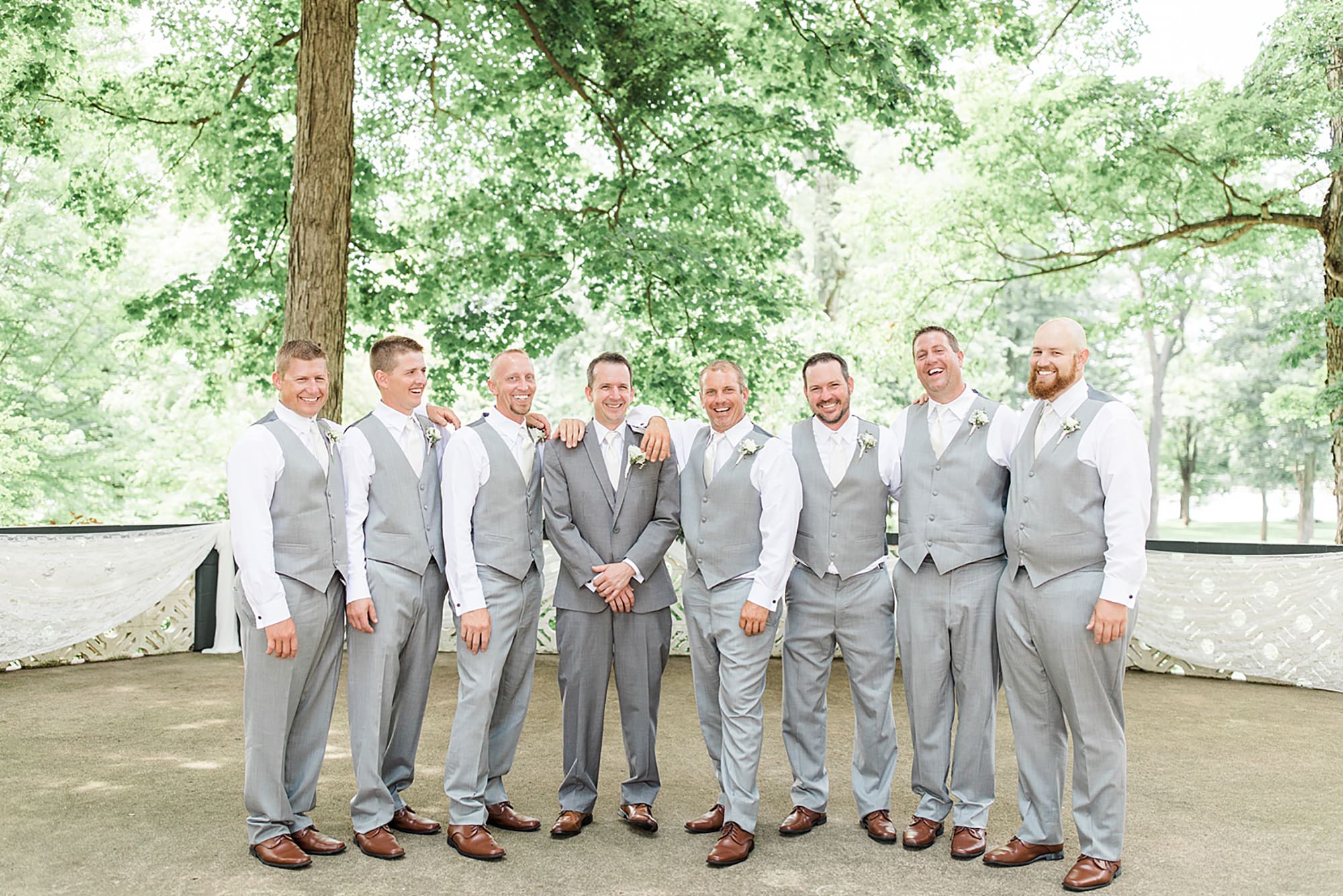 Arielle Peters Photography | Groom and groomsmen in park on wedding day at Winona Heritage Room in Winona Lake, Indiana.