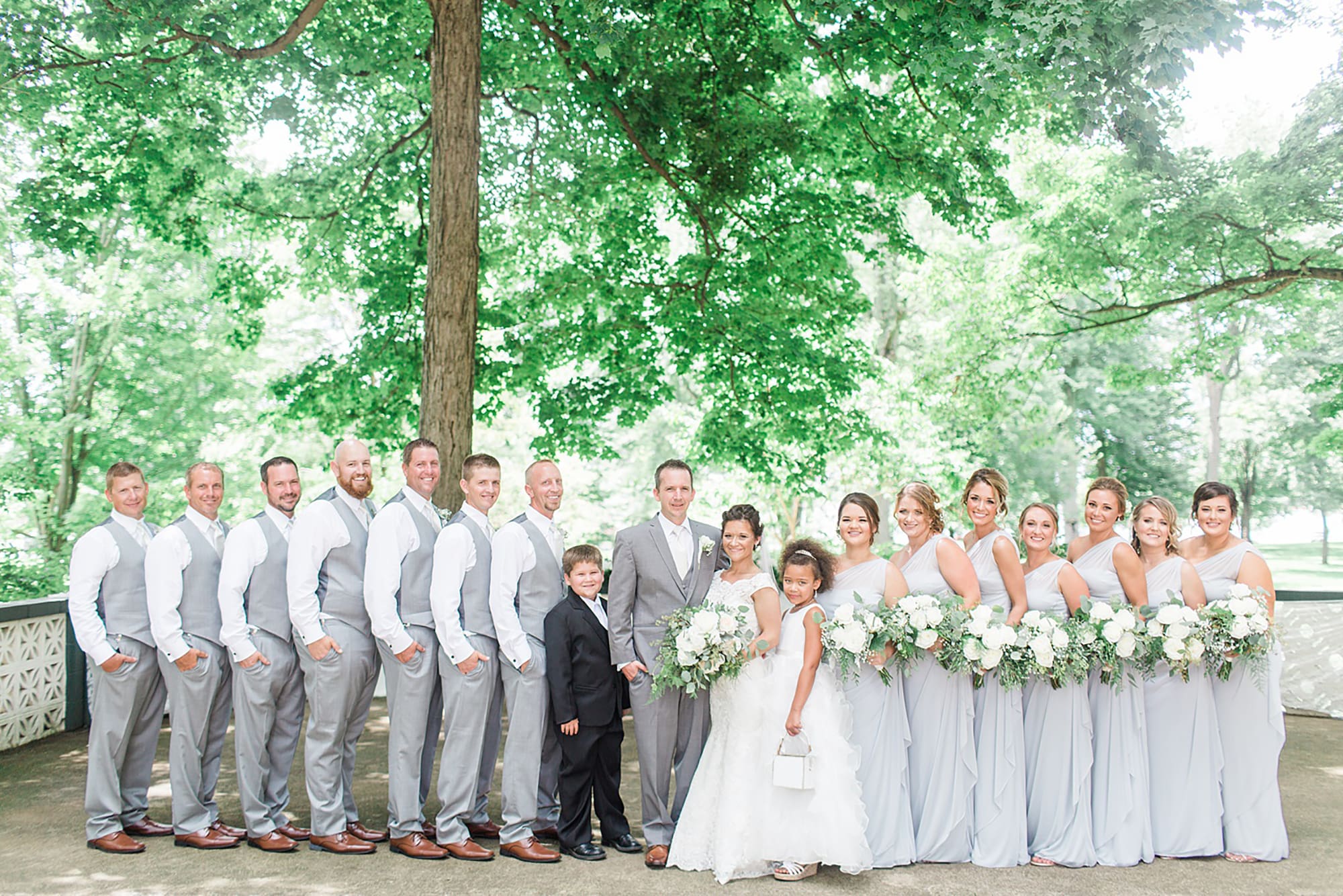 Arielle Peters Photography | Wedding party in park on wedding day at Winona Heritage Room in Winona Lake, Indiana.