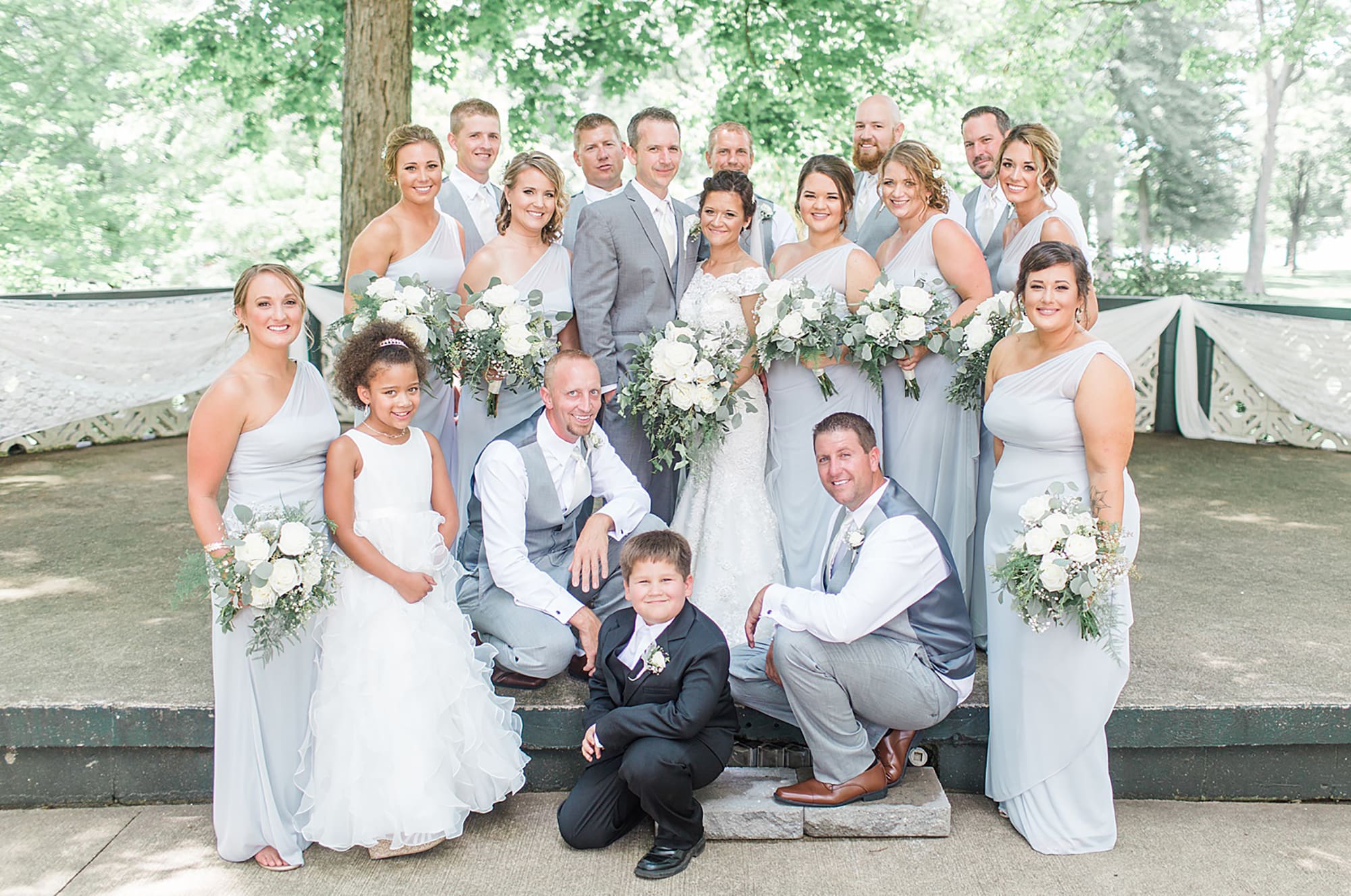 Arielle Peters Photography | Wedding party in park on wedding day at Winona Heritage Room in Winona Lake, Indiana.