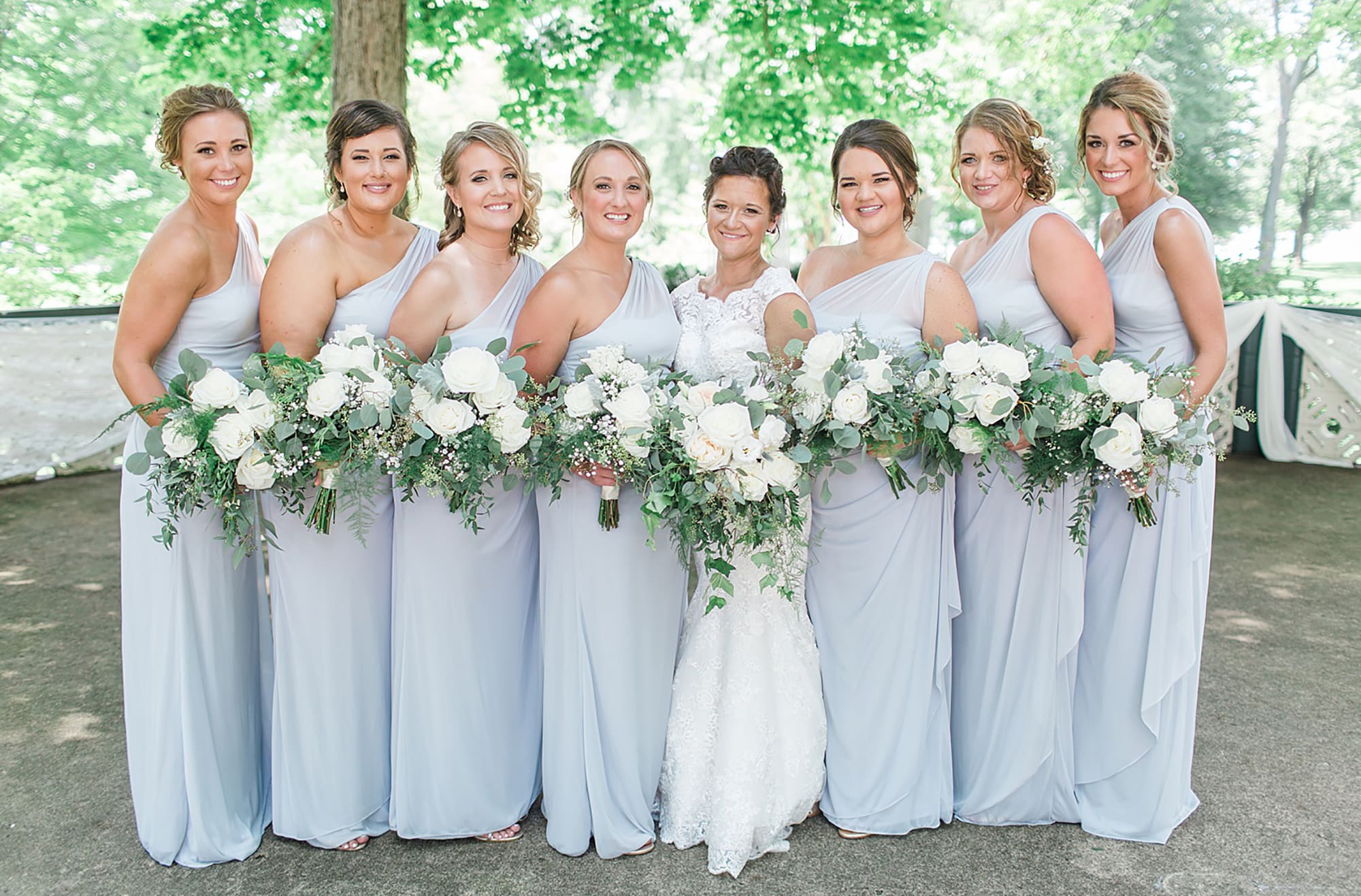Arielle Peters Photography | Bride and bridesmaids in the park on wedding day at Winona Heritage Room in Winona Lake, Indiana.