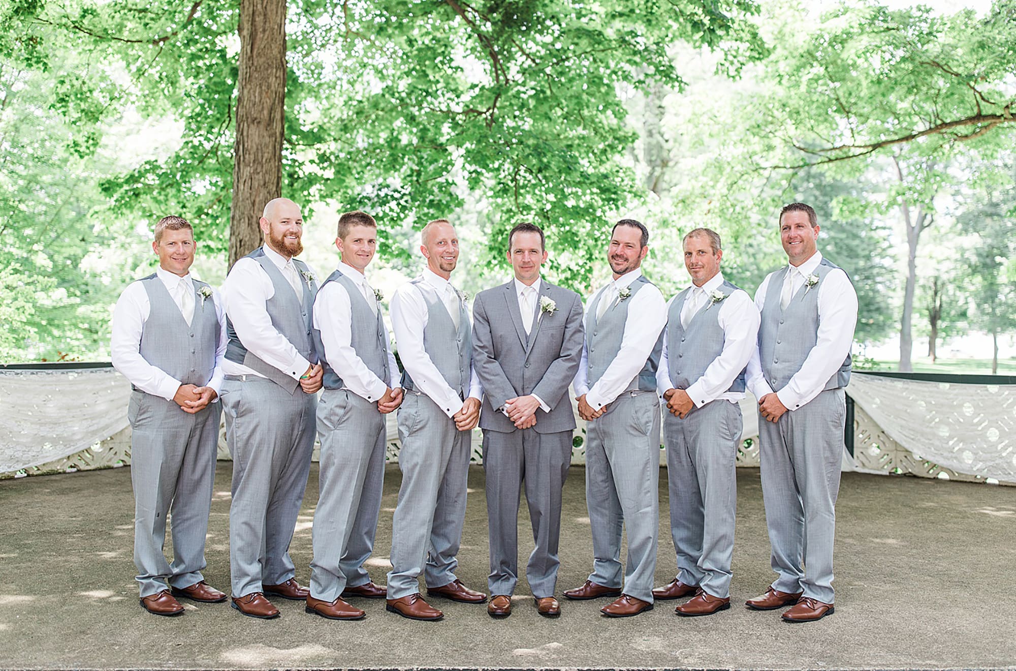 Arielle Peters Photography | Groom and groomsmen in the park on wedding day at Winona Heritage Room in Winona Lake, Indiana.
