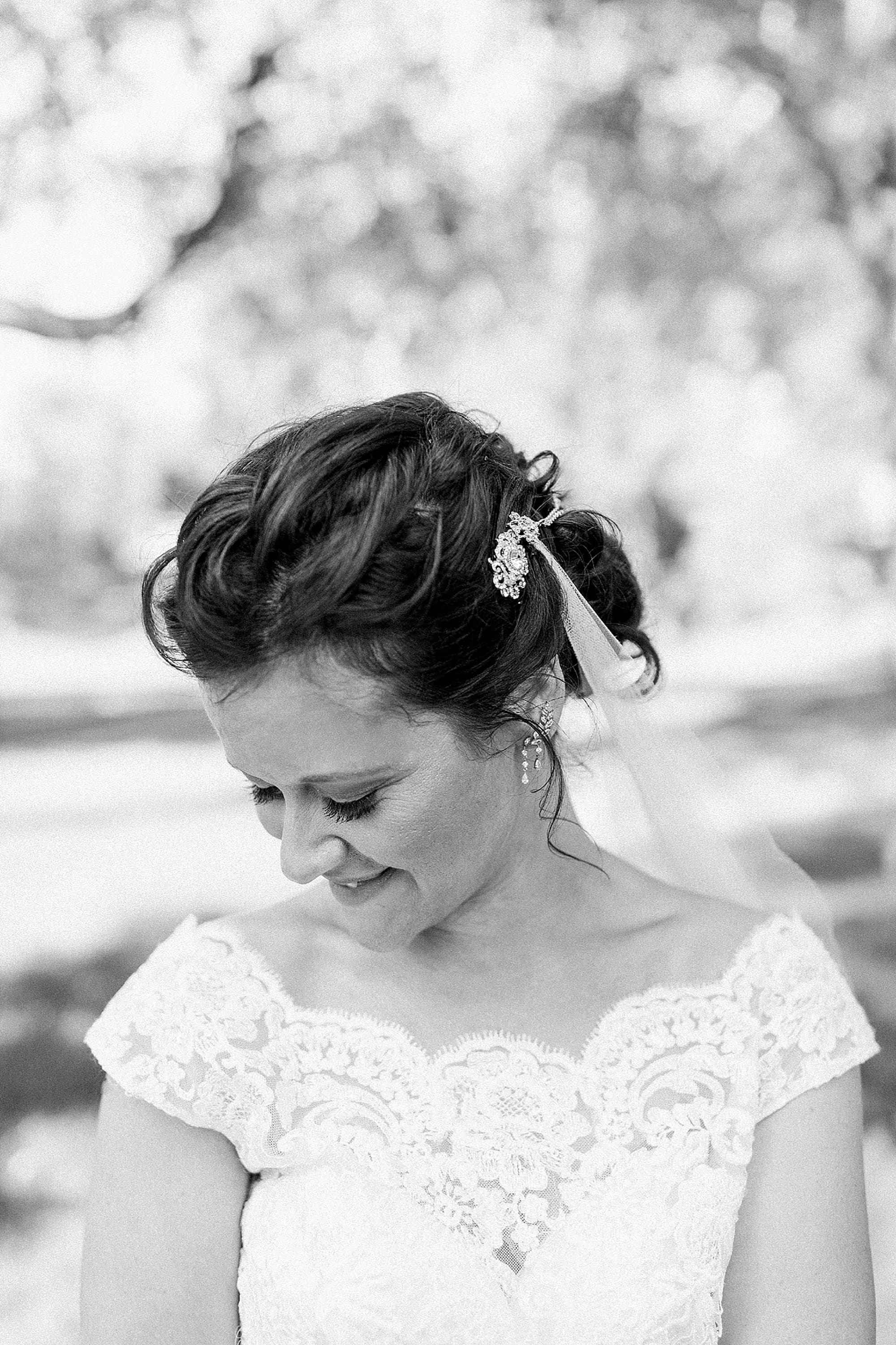 Arielle Peters Photography | Bride smiling in park on wedding day at Winona Heritage Room in Winona Lake, Indiana.