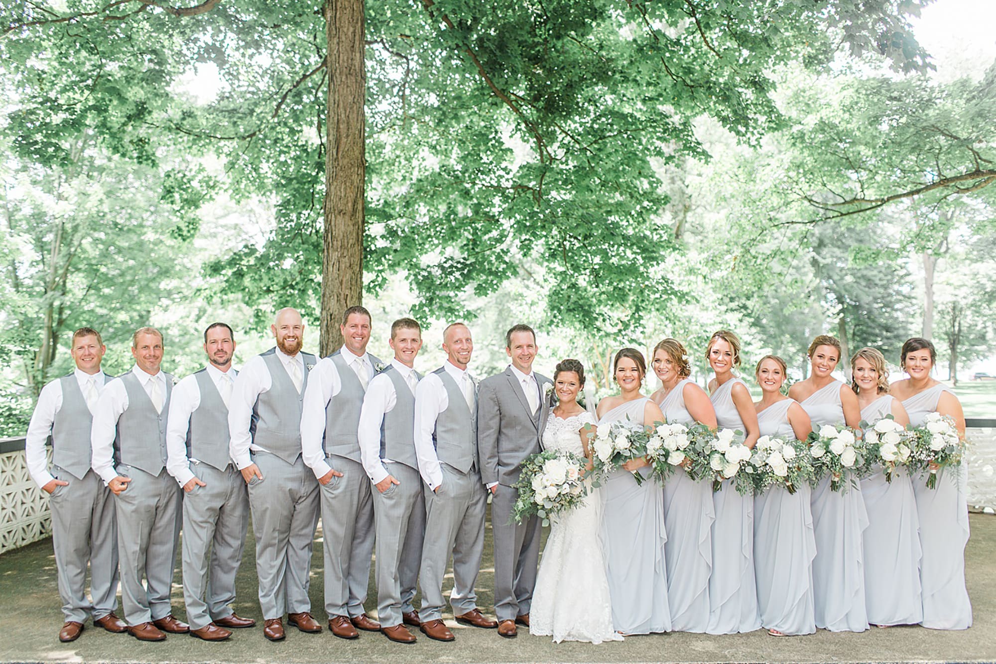 Arielle Peters Photography | Wedding party in park on wedding day at Winona Heritage Room in Winona Lake, Indiana.