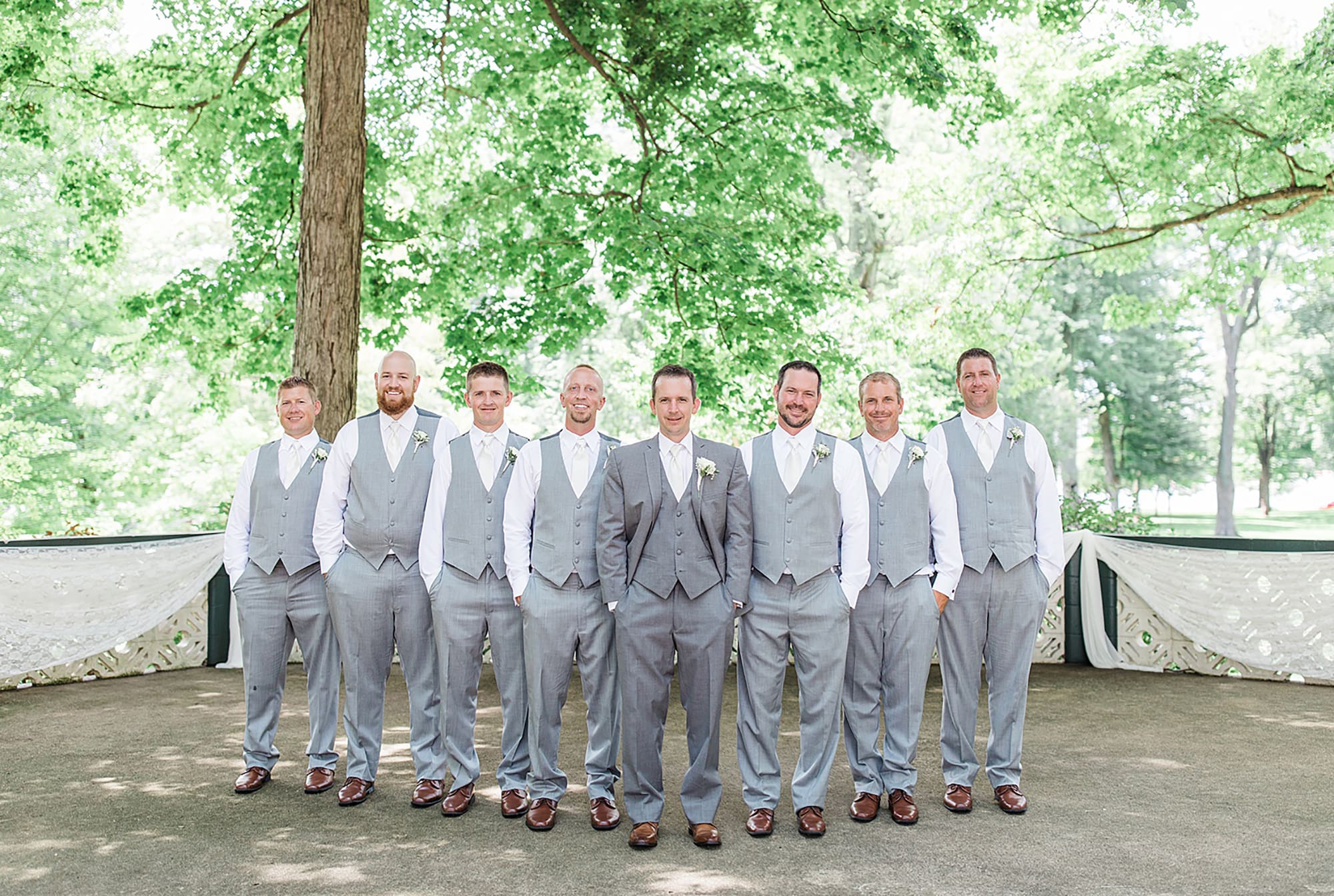 Arielle Peters Photography | Groom and groomsmen in park on wedding day at Winona Heritage Room in Winona Lake, Indiana.