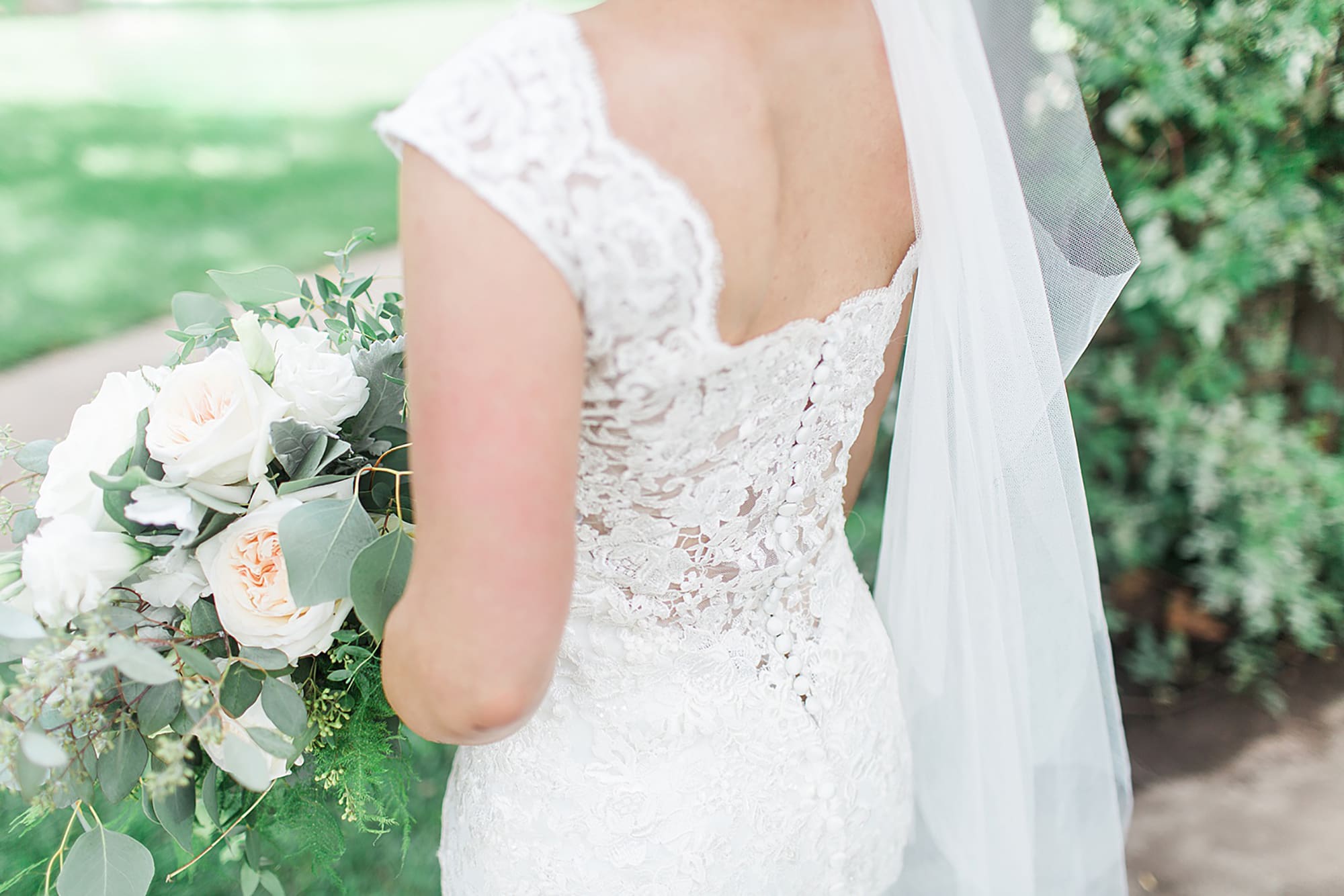 Arielle Peters Photography | Bride's wedding dress back detail on wedding day at Winona Heritage Room in Winona Lake, Indiana.