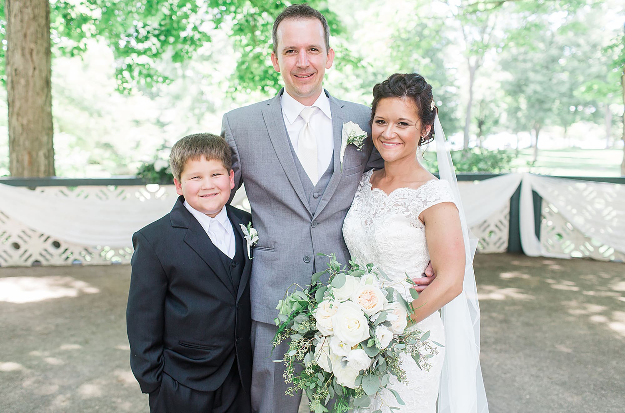 Arielle Peters Photography | Bride and groom with their son on wedding day at Winona Heritage Room in Winona Lake, Indiana.