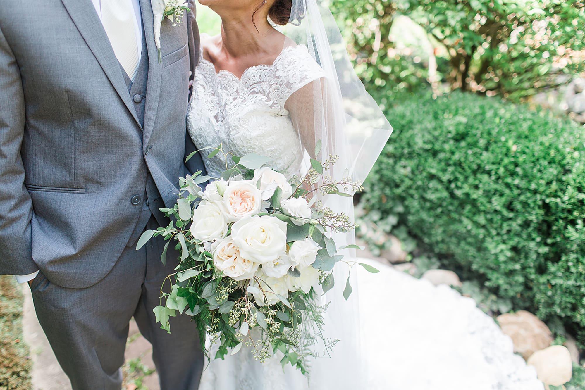 Arielle Peters Photography | Bride and groom on garden path on wedding day at Winona Heritage Room in Winona Lake, Indiana.
