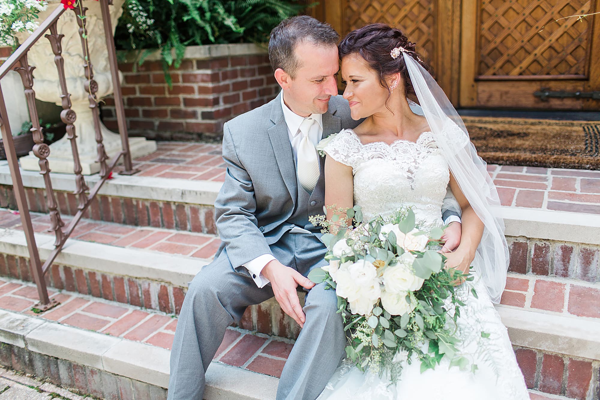 Arielle Peters Photography | Bride and groom on brick steps on wedding day at Winona Heritage Room in Winona Lake, Indiana.