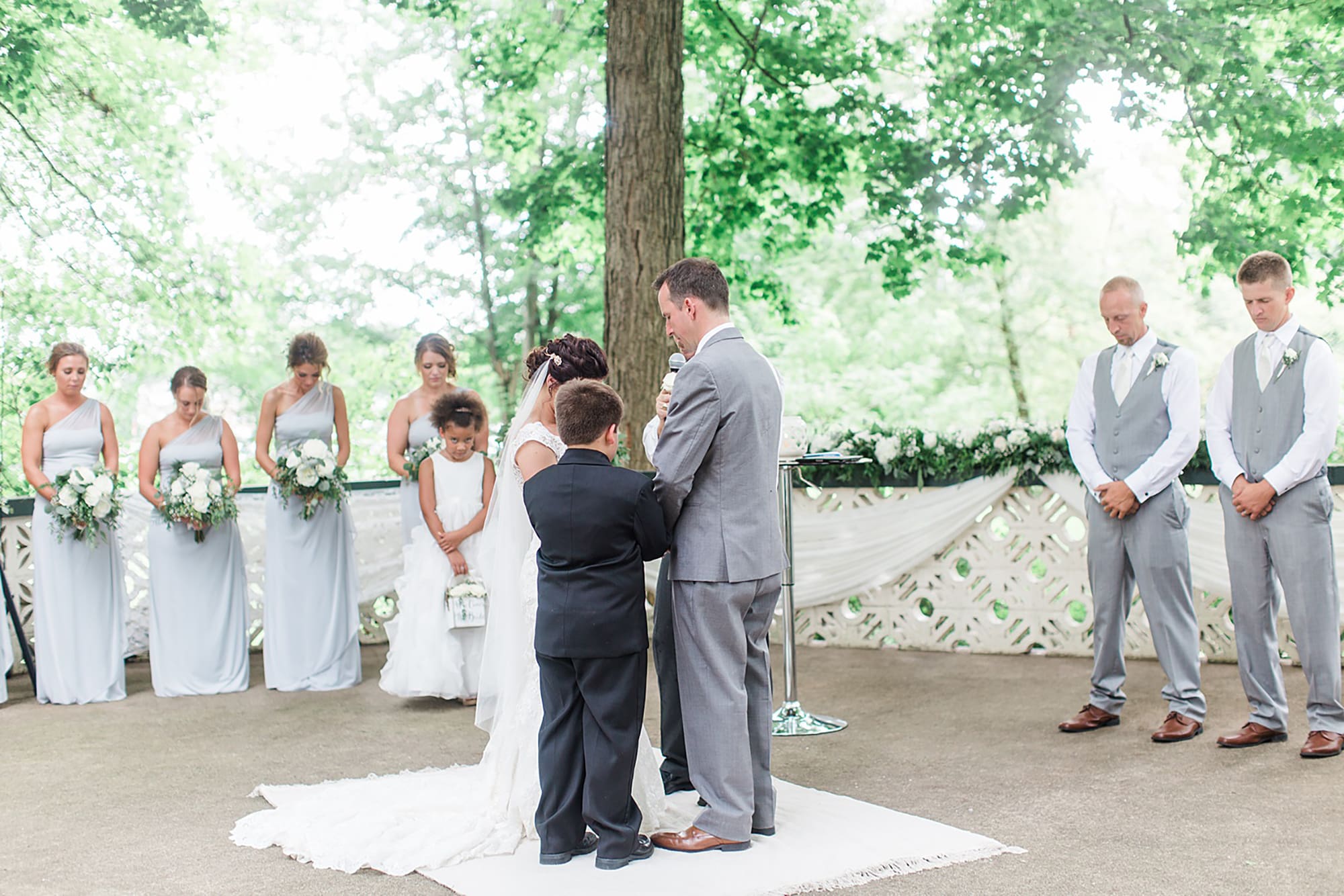 Arielle Peters Photography | Bride and groom praying at outdoor alter on wedding day at Winona Heritage Room in Winona Lake, Indiana.