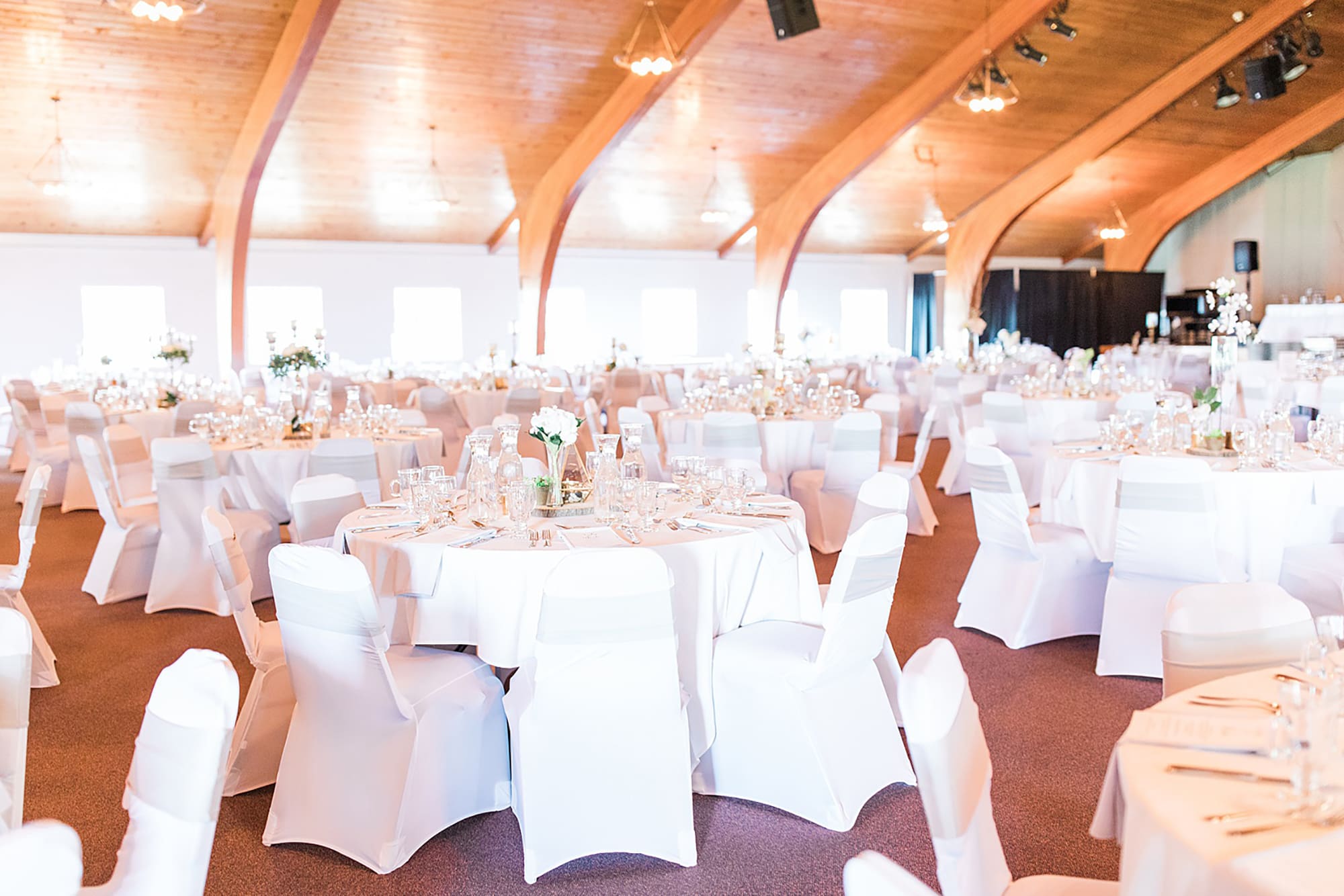 Arielle Peters Photography | Wedding reception table settings and floral arrangements on wedding day at Winona Heritage Room in Winona Lake, Indiana.
