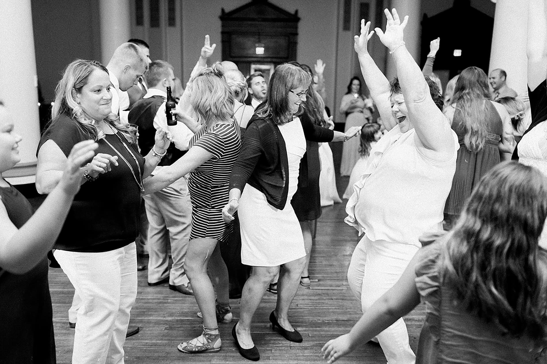 Arielle Peters Photography | Wedding guests dancing at reception on wedding day at the Freemasons Hall in Fort Wayne, Indiana.