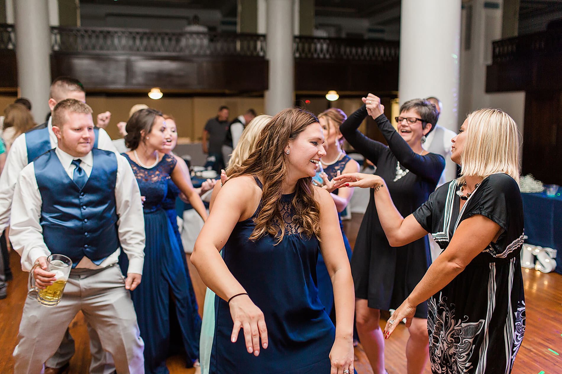 Arielle Peters Photography | Wedding guests dancing at reception on wedding day at the Freemasons Hall in Fort Wayne, Indiana.